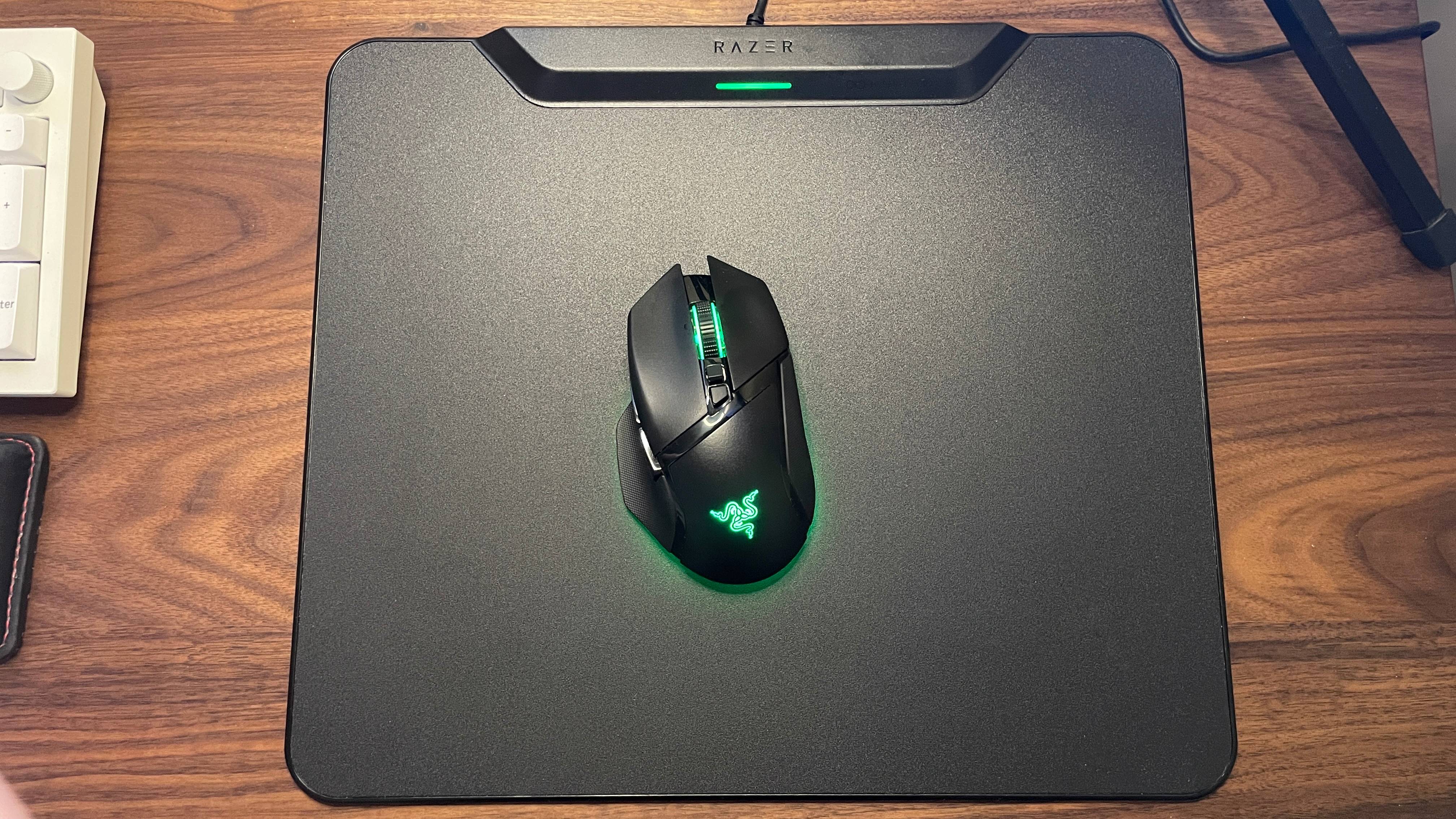 Top-down view of Razer HyperFlux V2 Charging Mouse System mouse pad with Basilisk V3 Pro 35K gaming mouse on top