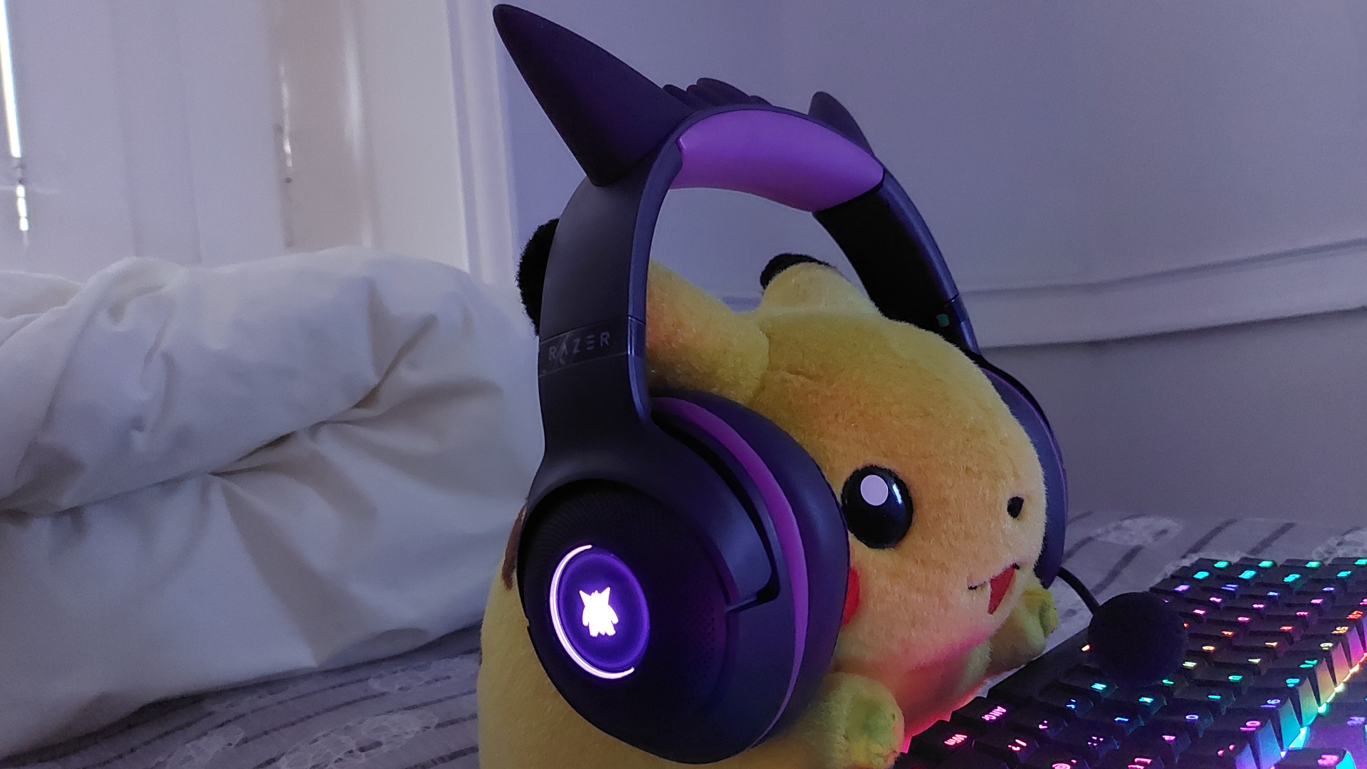The Razer Kraken Kitty V2 - Gengar edition wired gaming headset is seen from various angles.