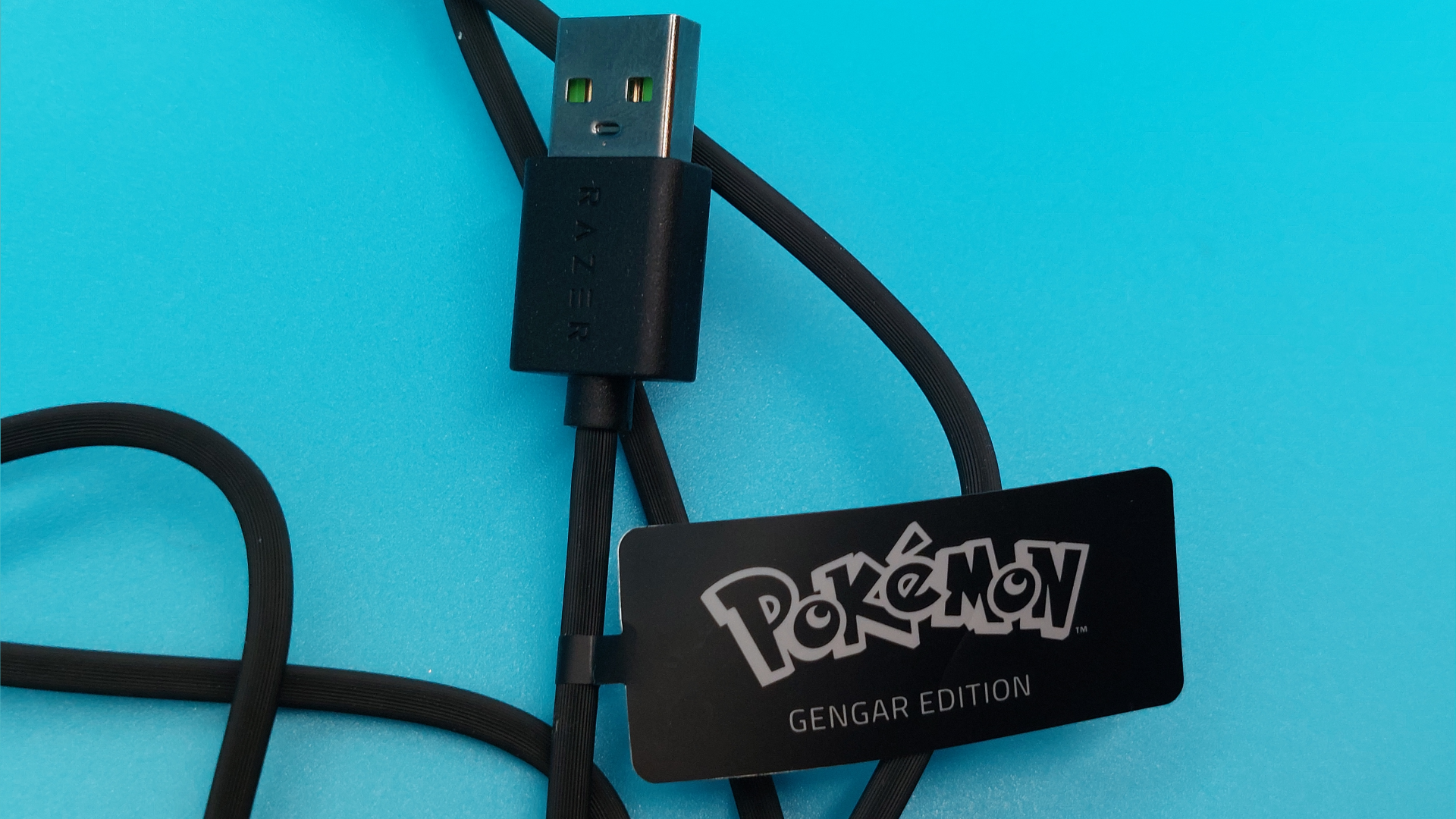 The Razer Kraken Kitty V2 - Gengar edition wired gaming headset is seen from various angles.