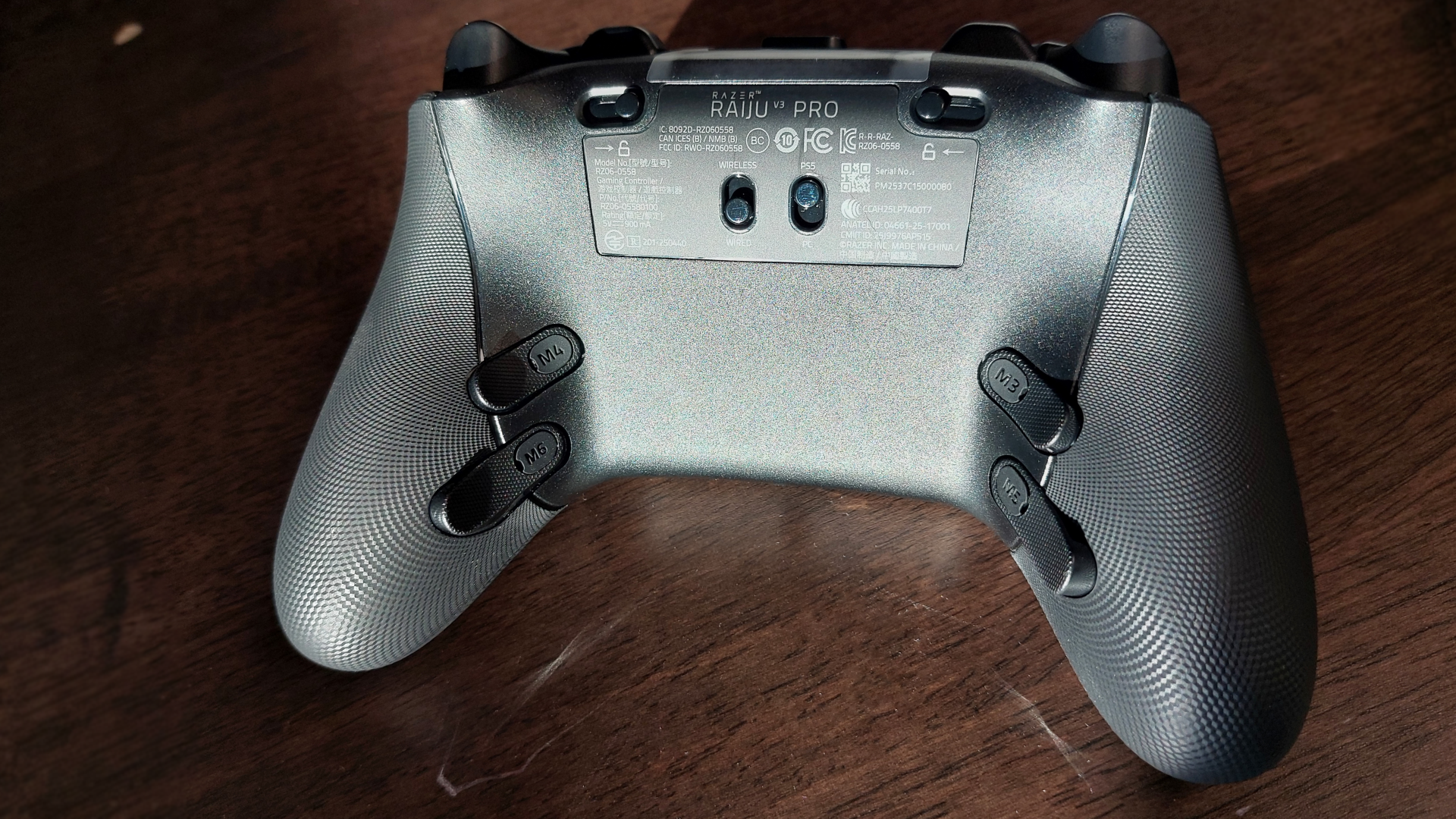 The Razer Raiju V3 Pro wireless controller seen from various angles.