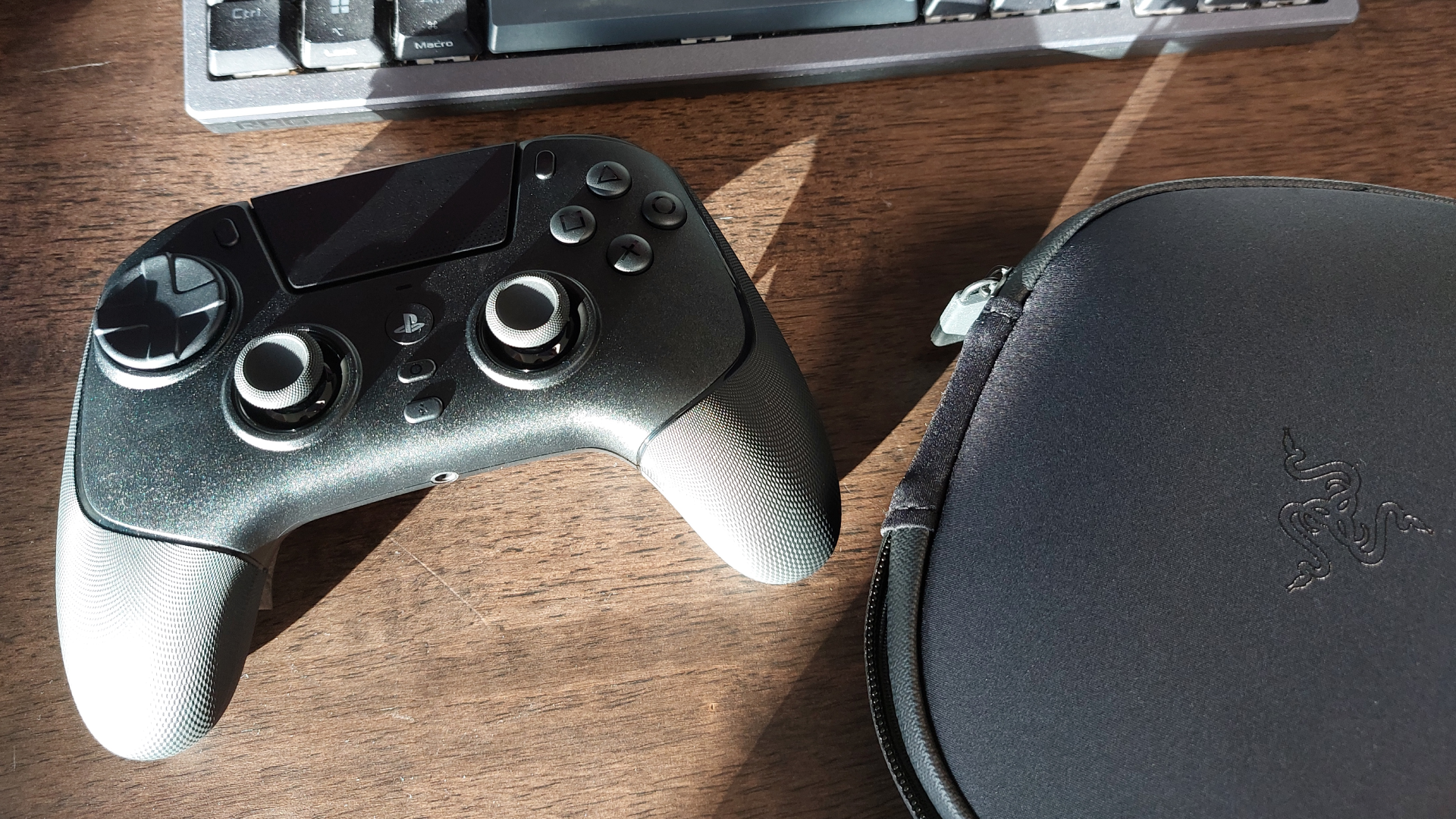 The Razer Raiju V3 Pro wireless controller seen from various angles.