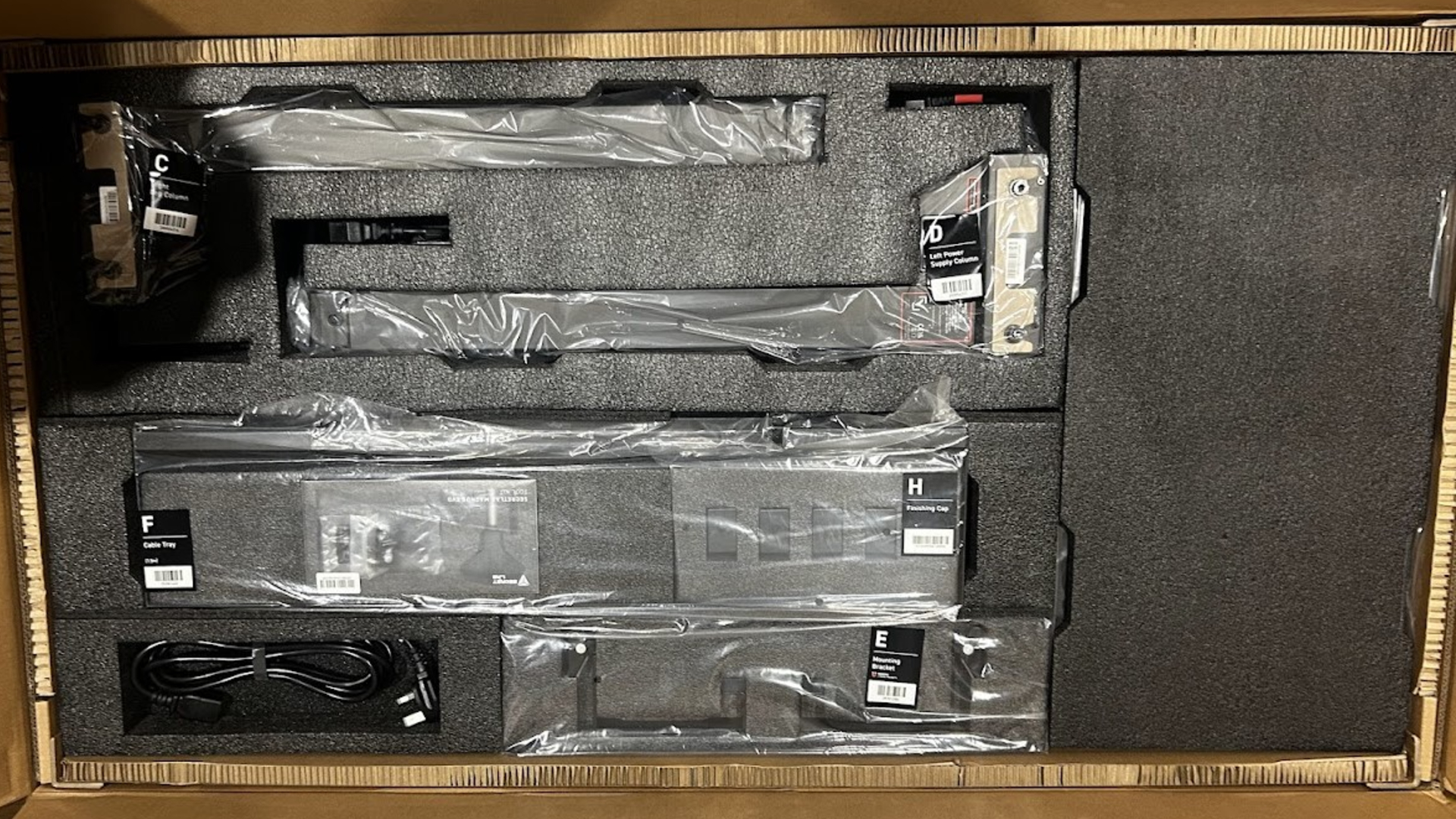 The contents inside the Secretlab Magnus Evo box with each individual part for assembly.