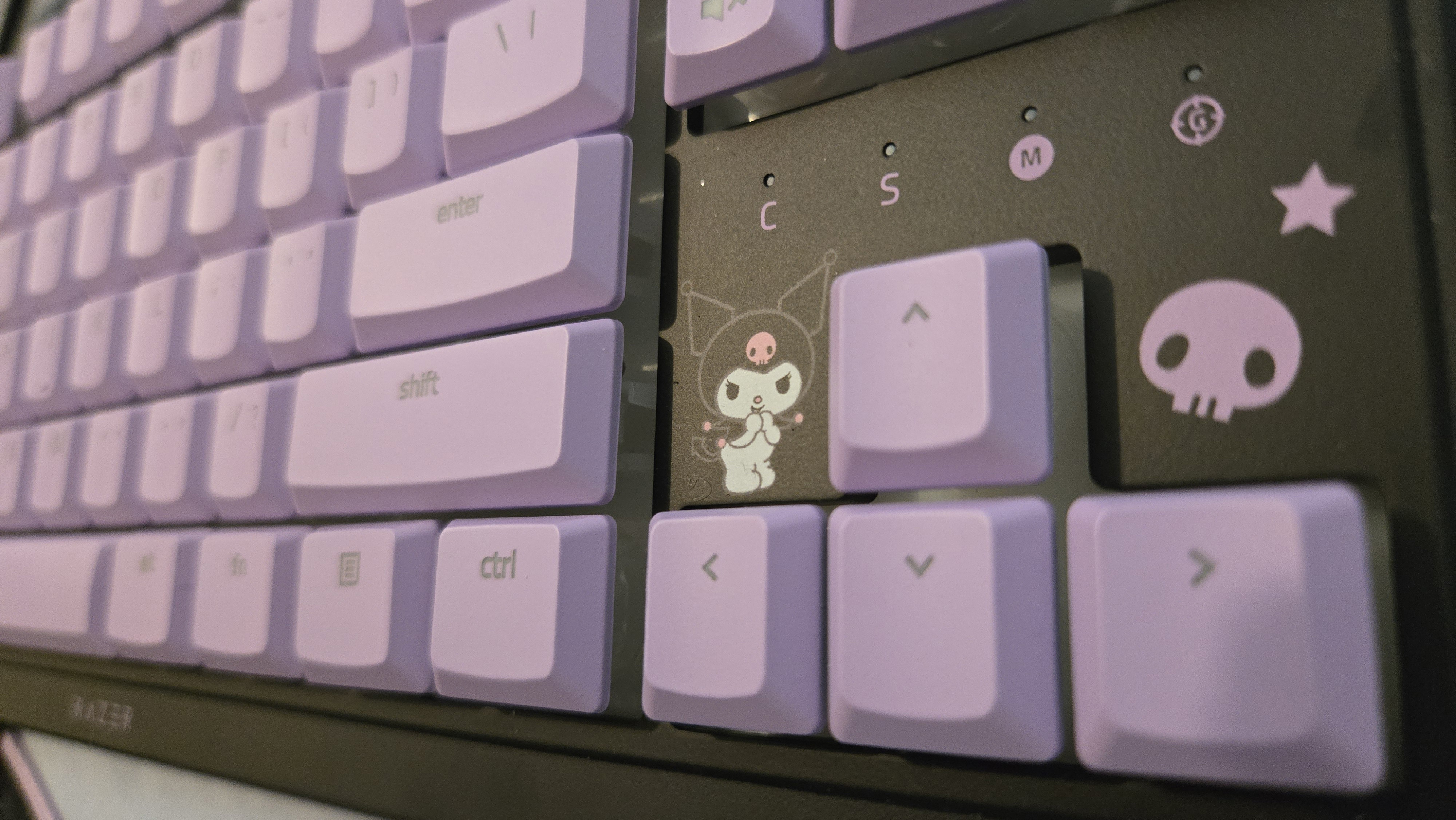 Razer | Kuromi collection peripherals laid out on a desk.