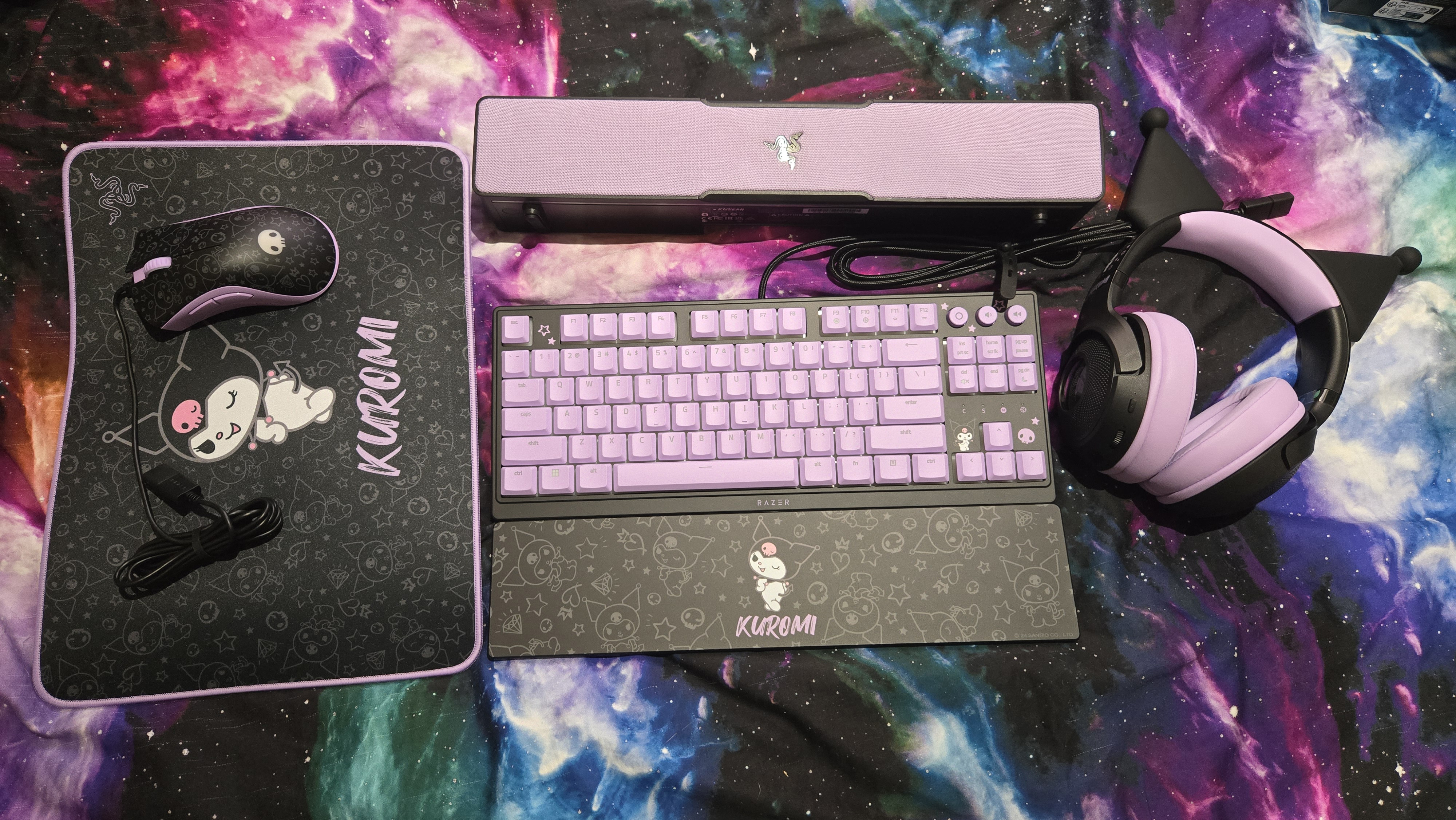 Razer | Kuromi collection peripherals laid out on a desk.