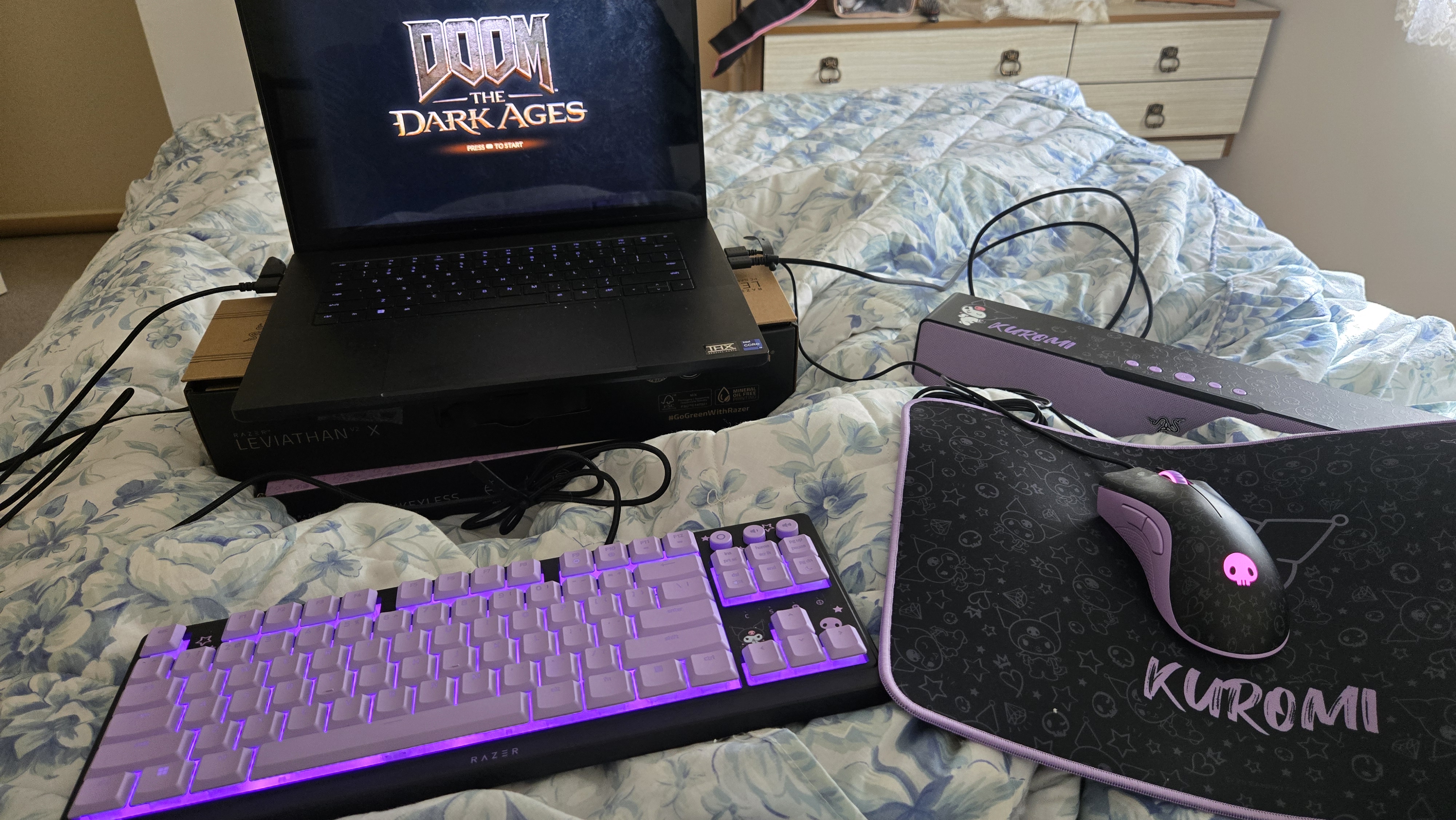 Razer | Kuromi collection peripherals laid out on a desk.