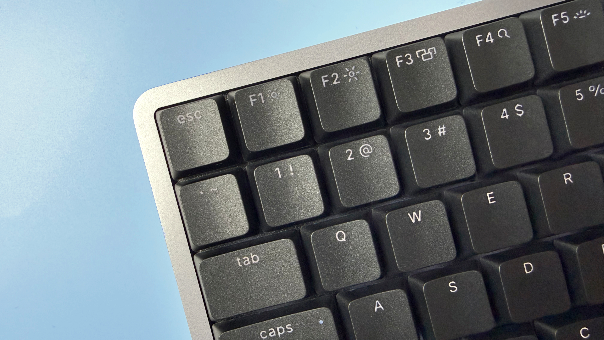 Lofree Flow 2 keyboard on a light blue background