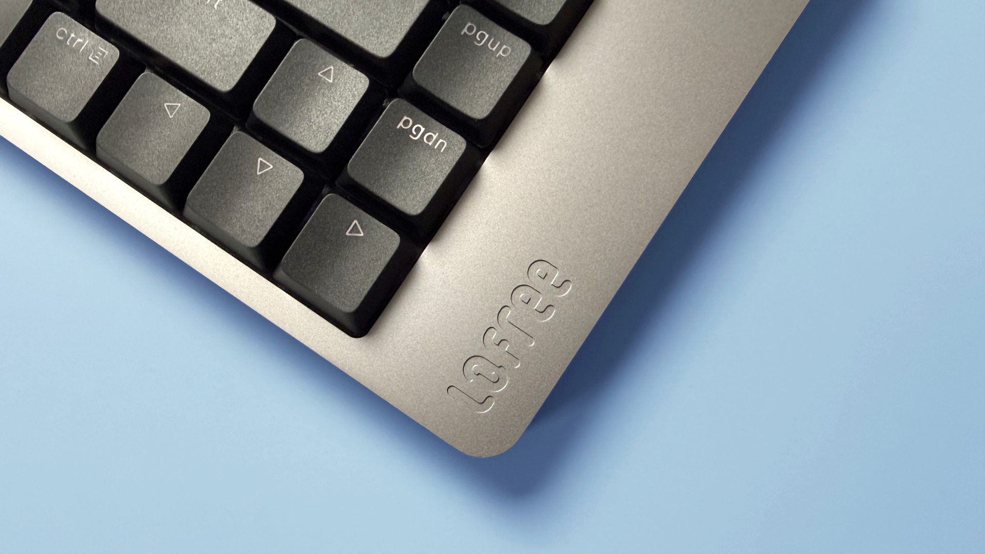 Lofree Flow 2 keyboard on a light blue background