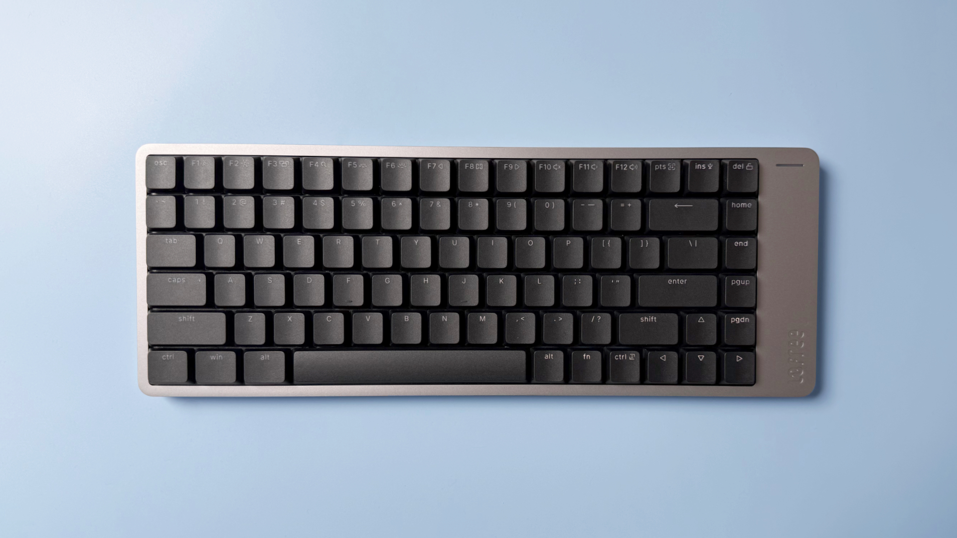 Lofree Flow 2 keyboard on a light blue background