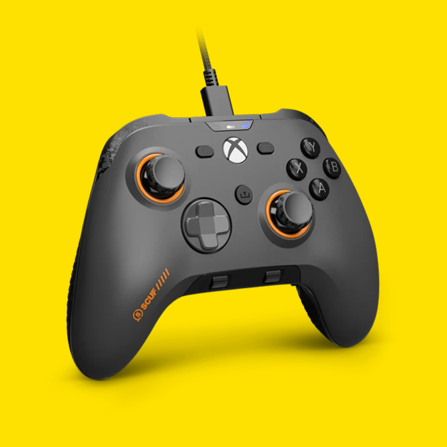 The Scuf Valor Pro wired controller on a yellow background