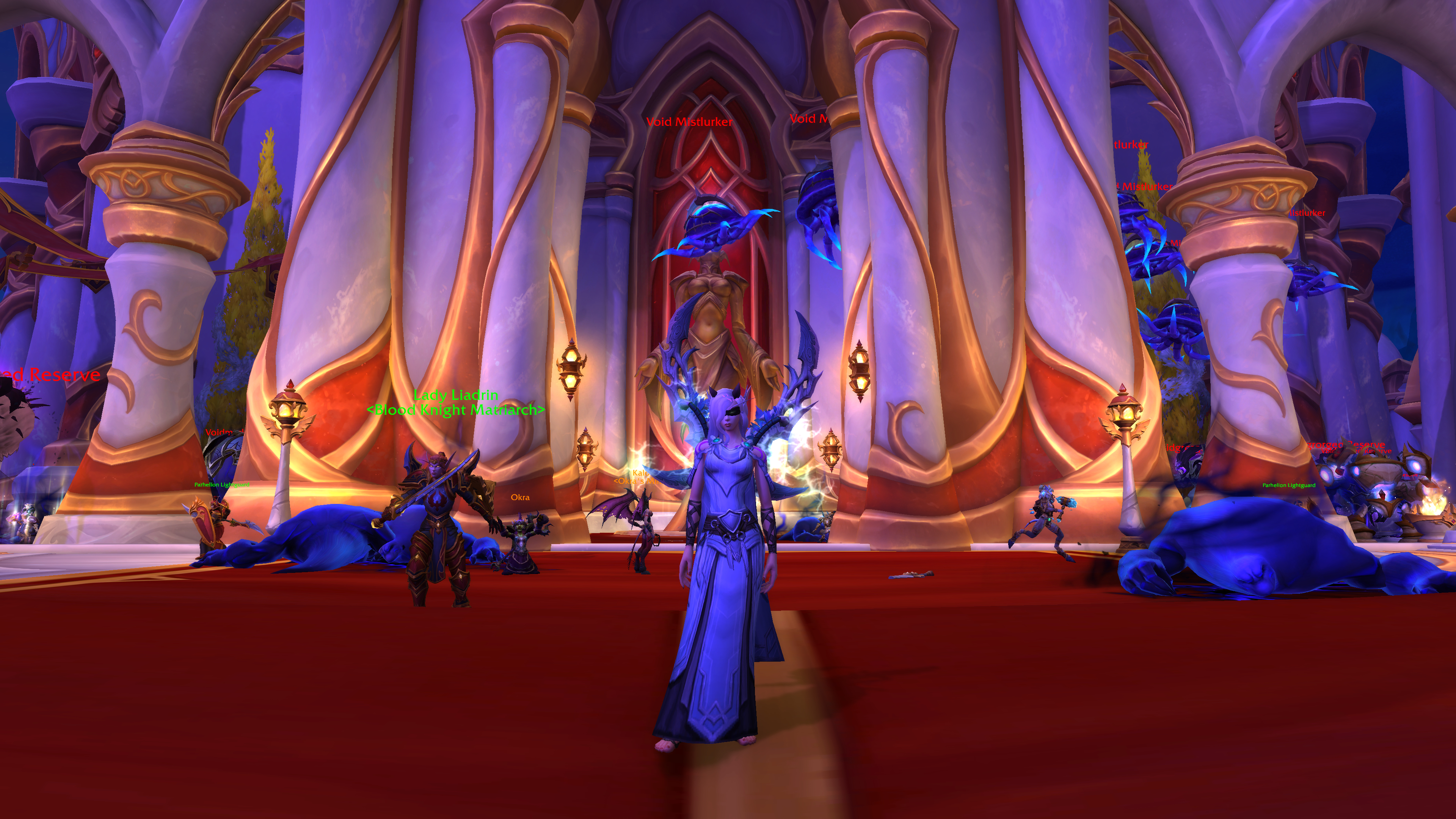 A screenshot of the World of Warcraft: Midnight alpha. A red carpet extends out through Silvermoon City. A blood elf player character demon hunter stands in the center wearing robes and has two sharp blades attached to her back.