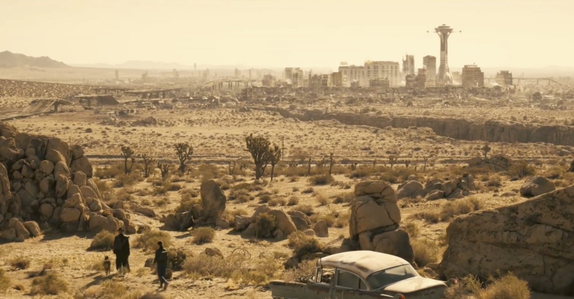 A screenshot from the Fallout season 2 trailer showing two characters on the outskirts of New Vegas