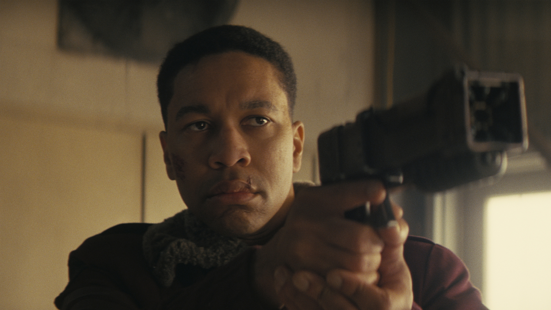 Max (Aaron Moten) from Fallout holding a gun