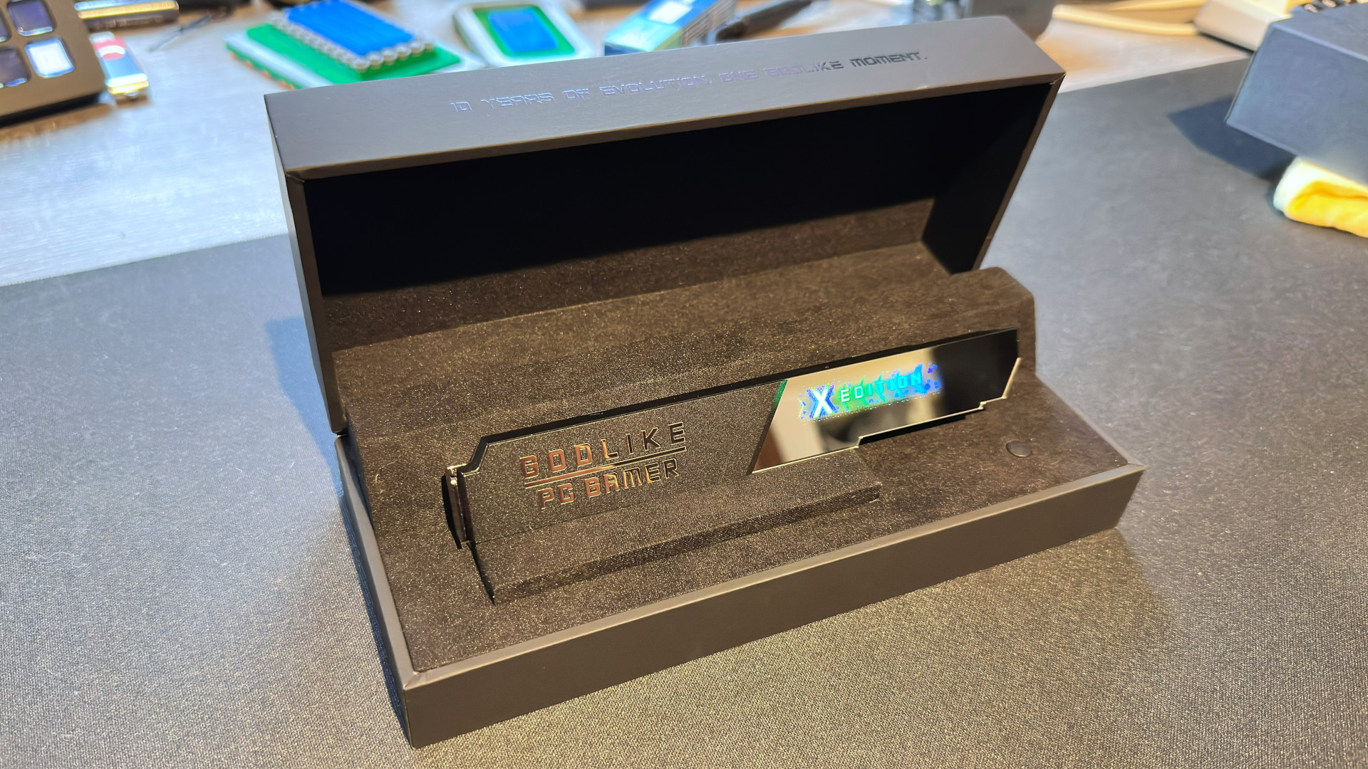 A photo showing the custom heatsink for an MSI MEG X870E Godlike X Edition motherboard, displayed in the included case