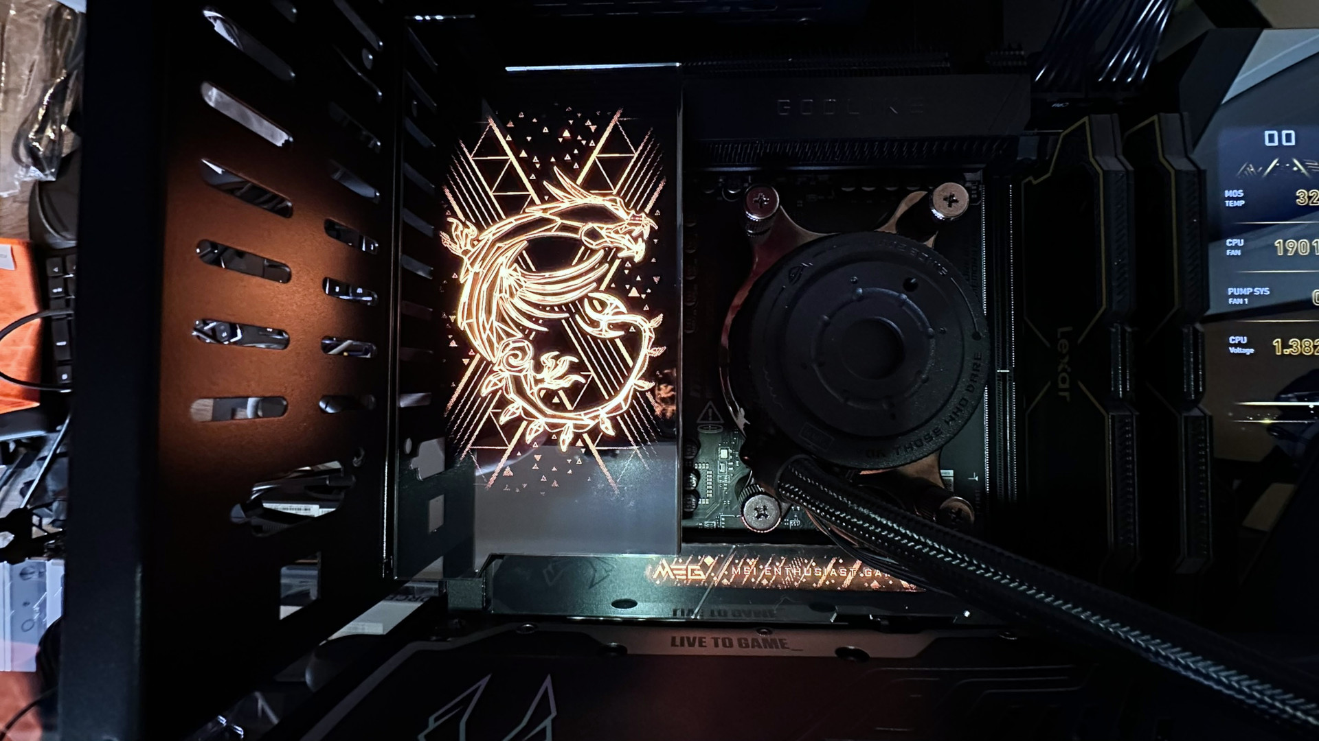 A dark photo showing the photochromic display on an MSI MEG X870E Godlike X Edition motherboard