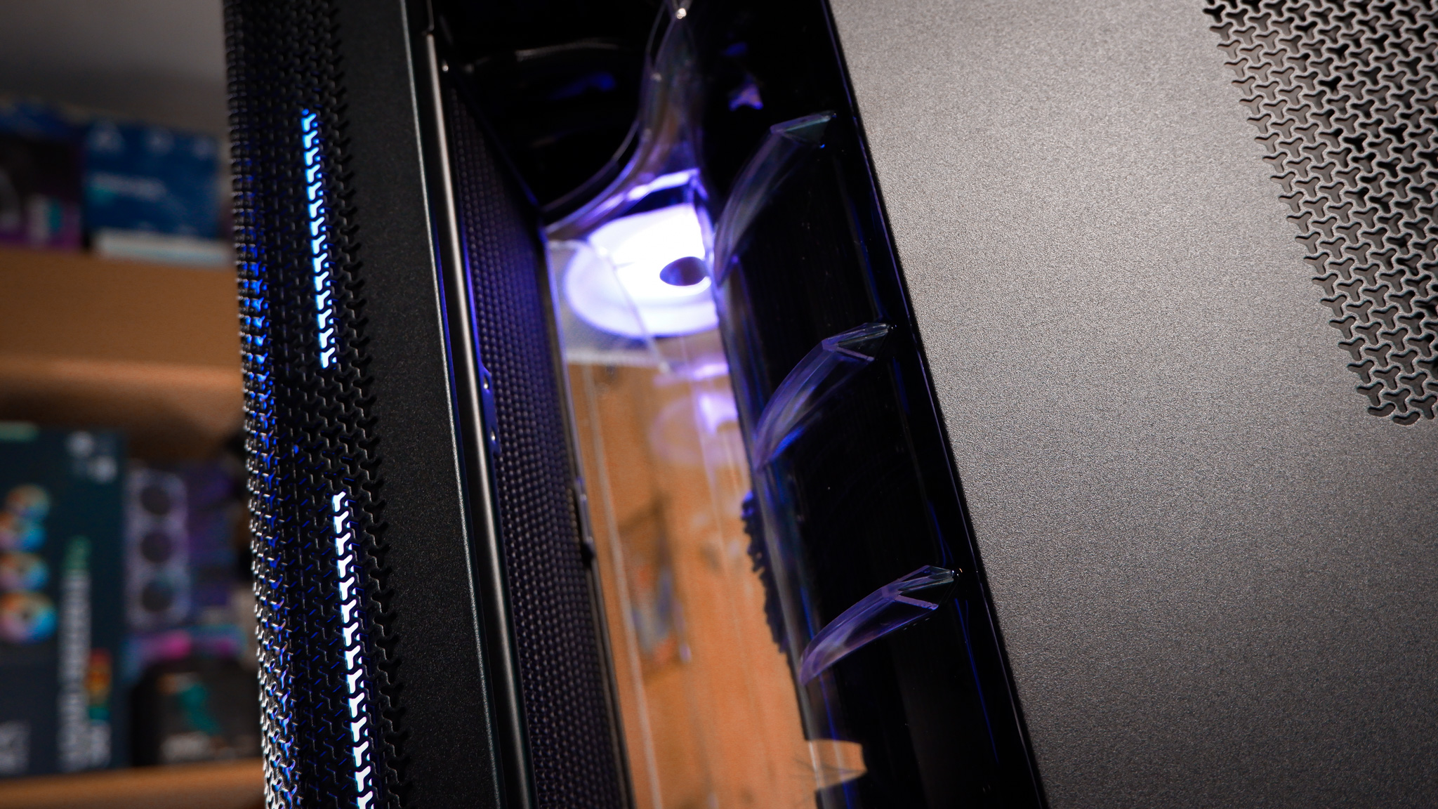 A Corsair Air 5400 PC case on a desk with various parts installed.