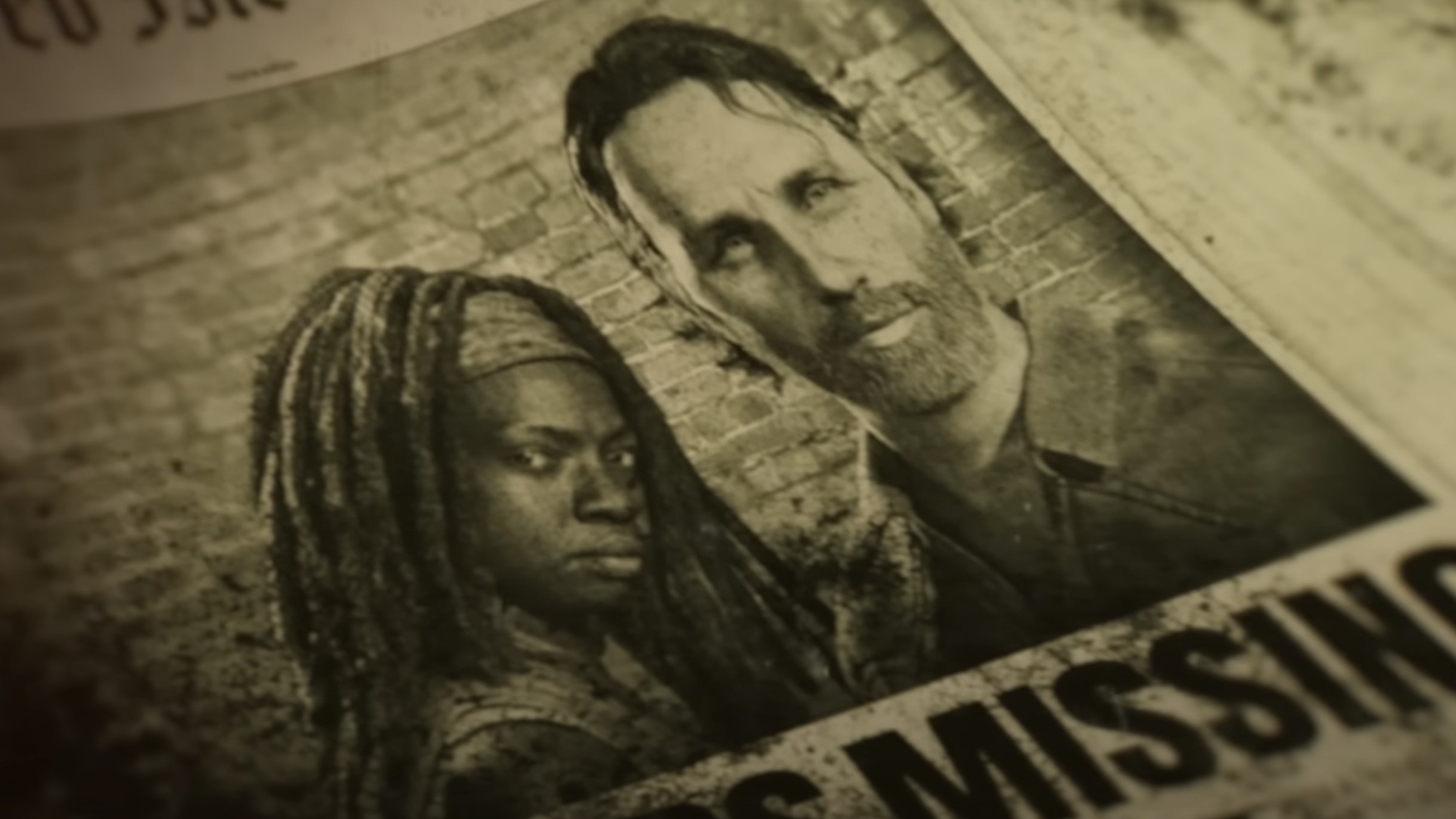 A picture of Michonne and Rick Grimes in a newspaper with the word