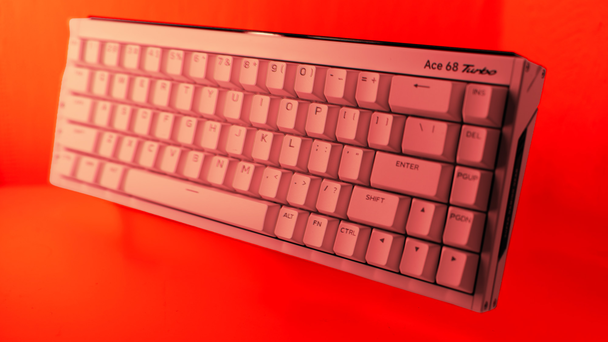 The Mchose Ace 68 Turbo on a red background.