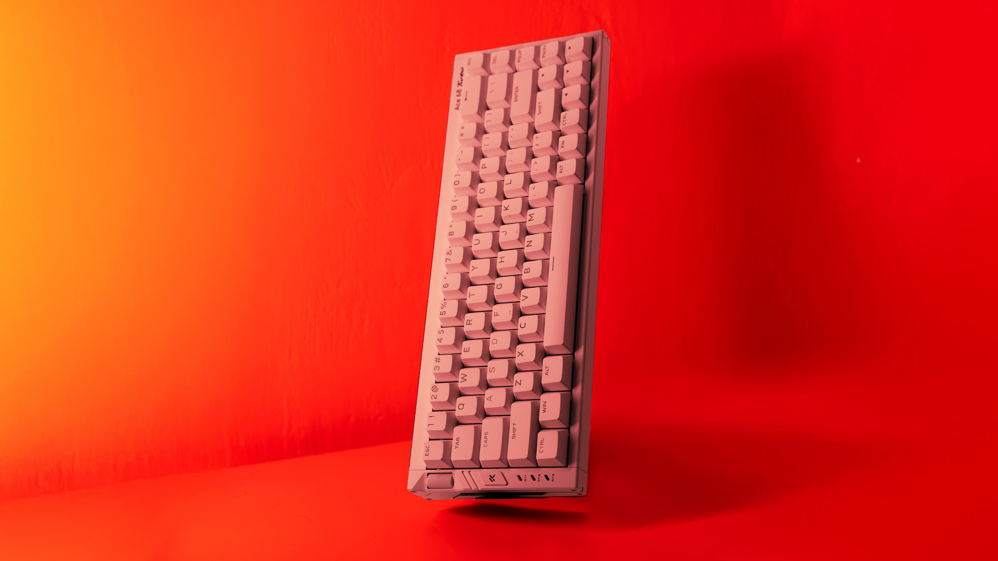 The Mchose Ace 68 Turbo on a red background.