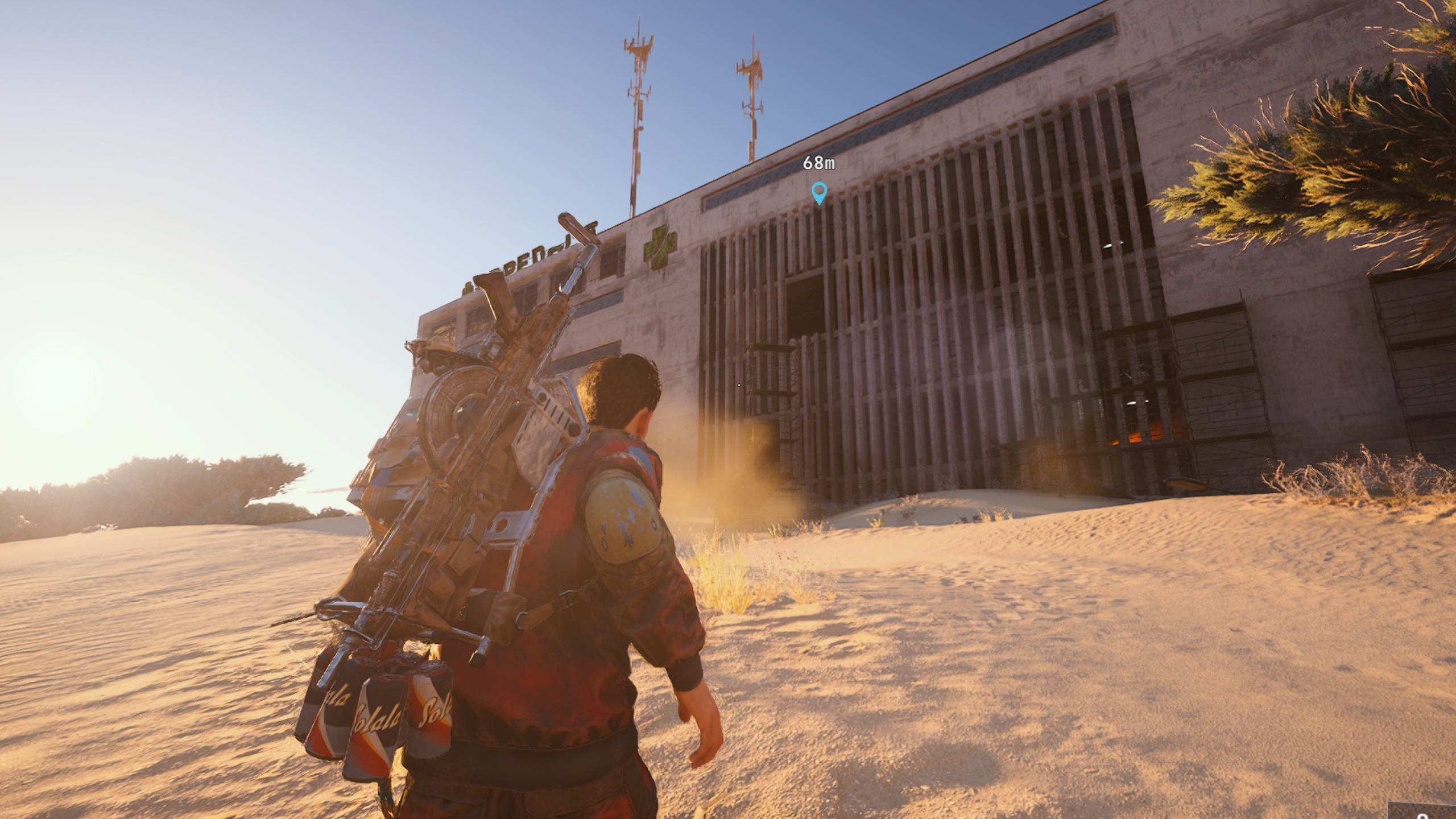 Arc Raiders laboratory reagents: A player running across sand towards Buried City's Hospital.