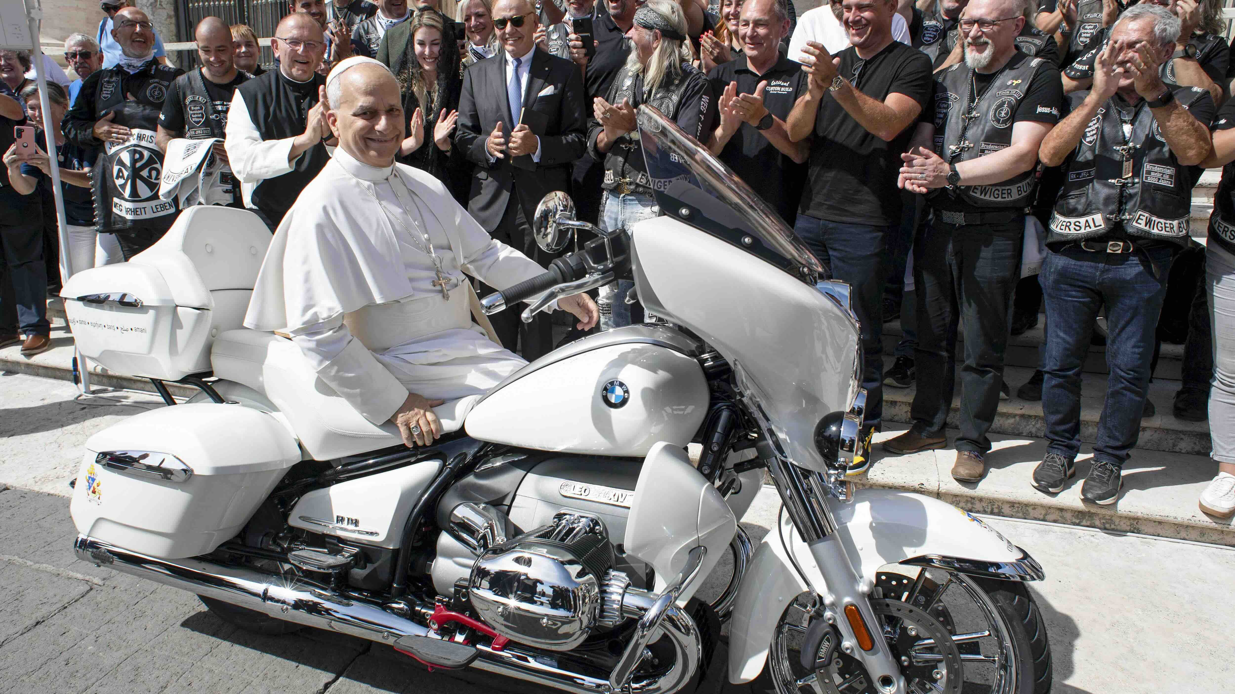 VATICAN CITY, VATICAN - SEPTEMBER 03: Pope Leo XIV receives a motorcycle as a gift during the General Weekly Audience at St. Peter's Square on September 03, 2025 in Vatican City, Vatican.