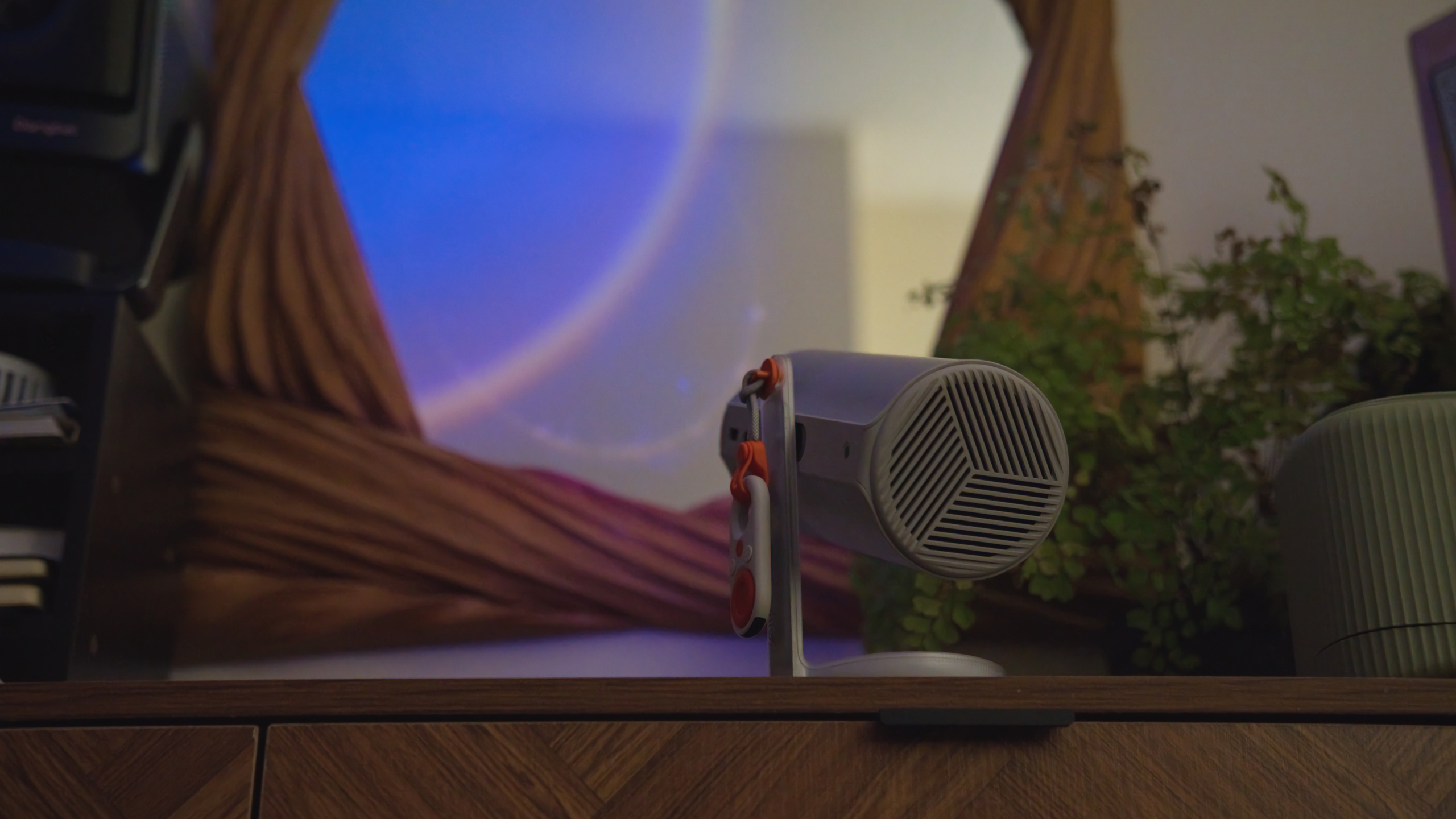 The XGIMI MoGo 4 Laser projector set-up with various accessories.