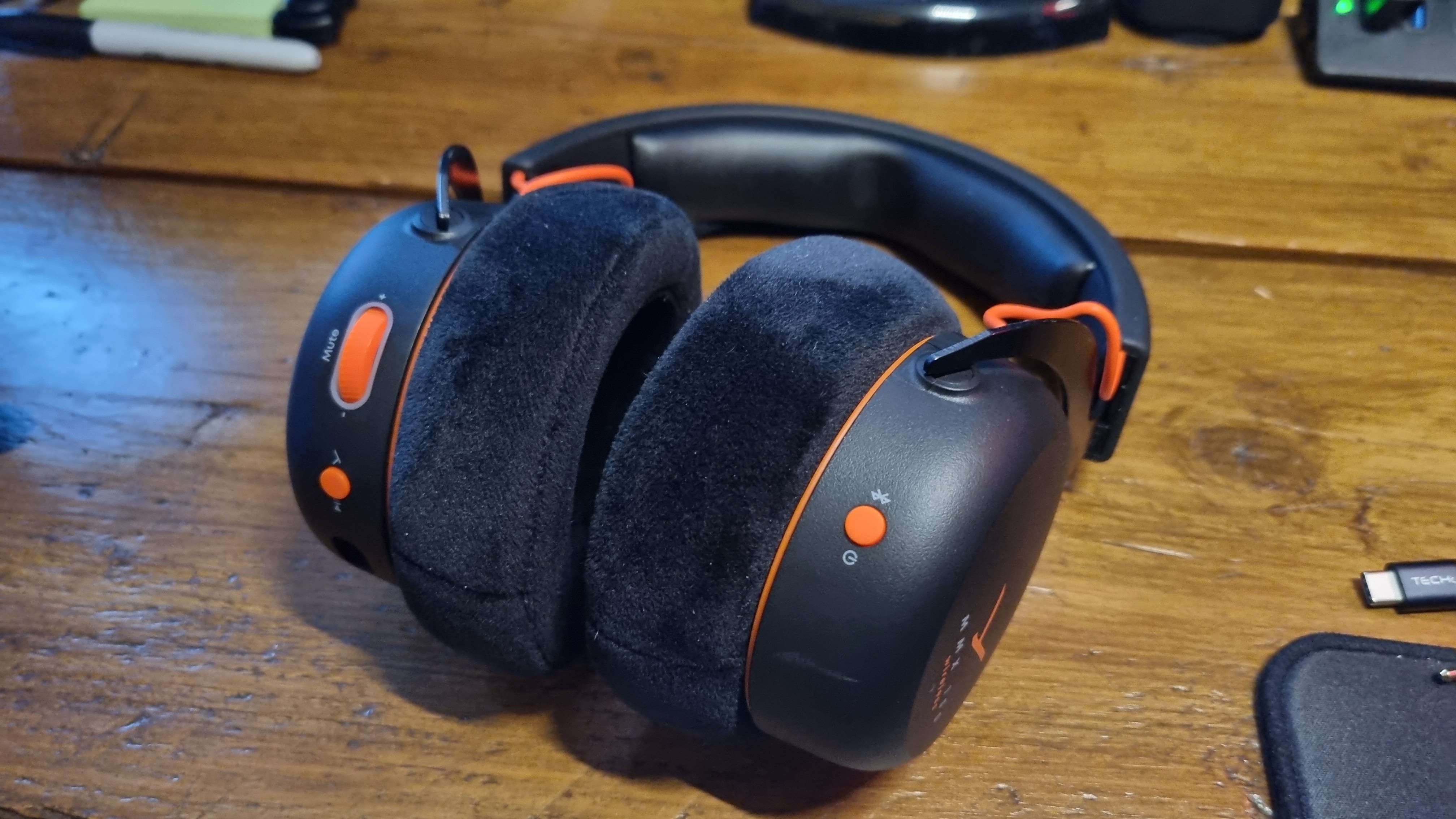 A Beyerdynamic MMX 150 Wireless gaming headset on a wooden desk