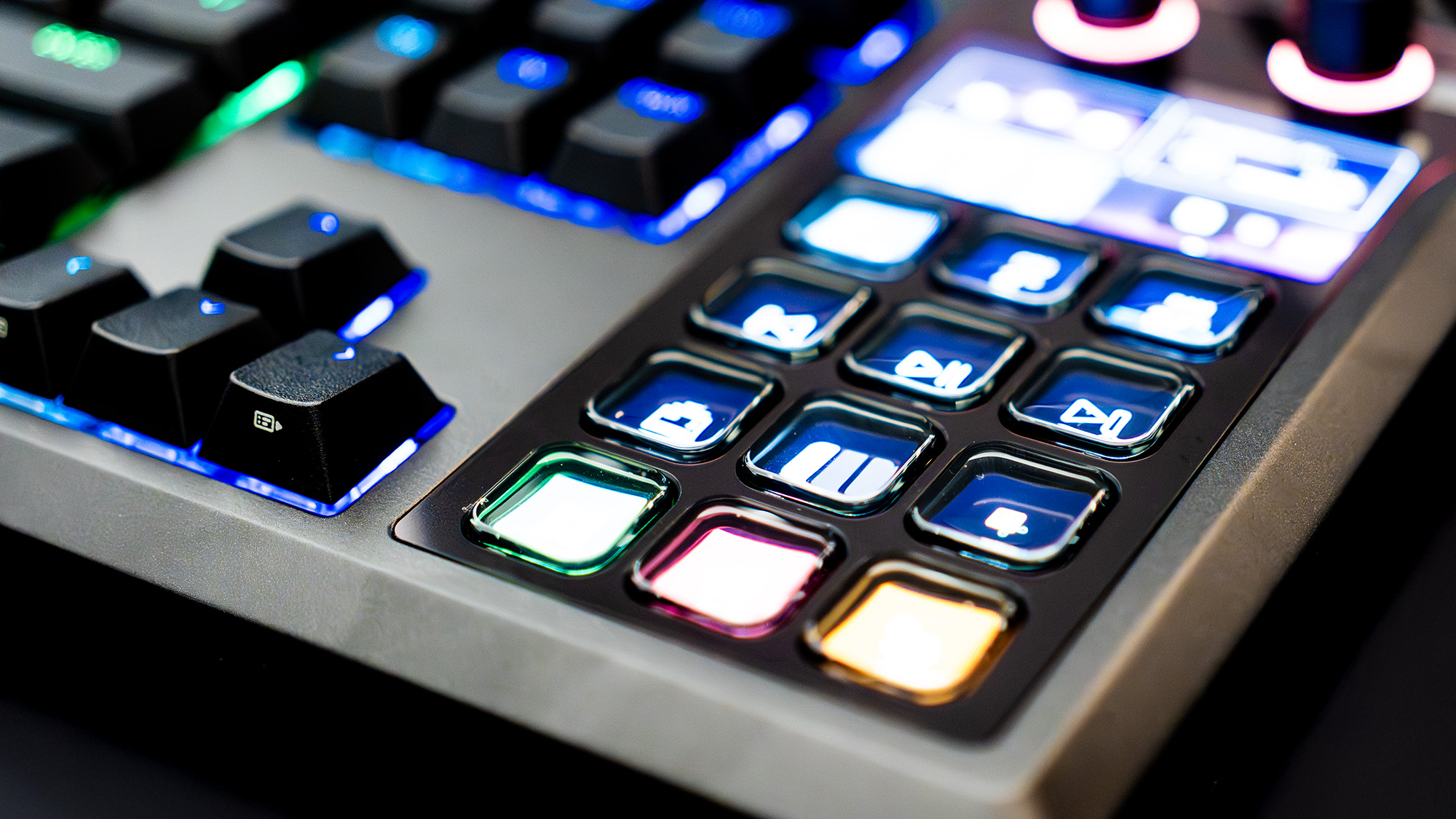 The Corsair Galleon 100 SD lit up with the Stream Deck side panel turned on and with various icons.
