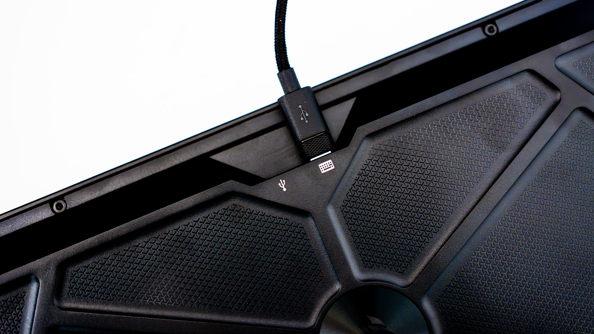 The Corsair Galleon 100 SD lit up with the Stream Deck side panel turned on and with various icons.