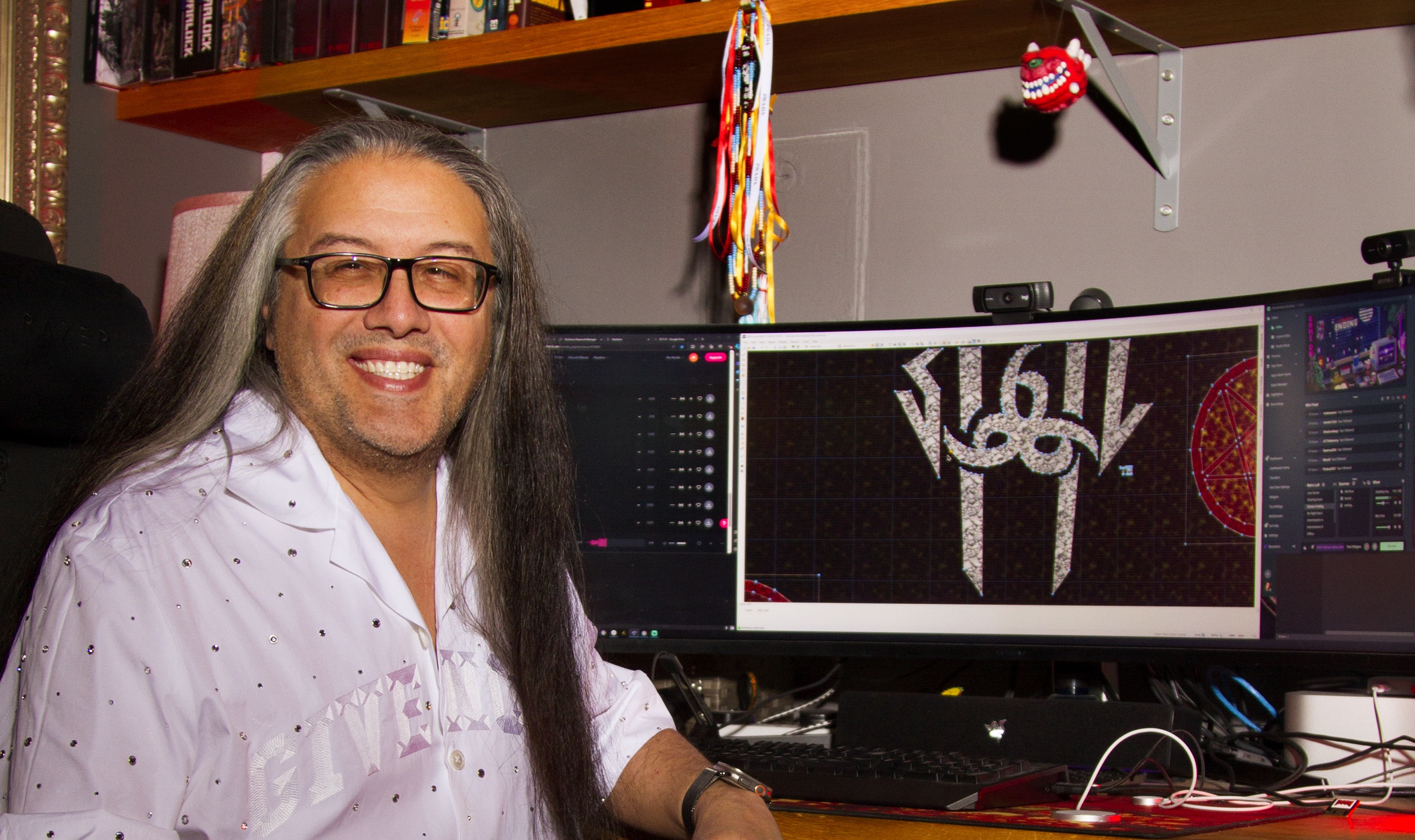 John Romero sitting in front of his Apple 2