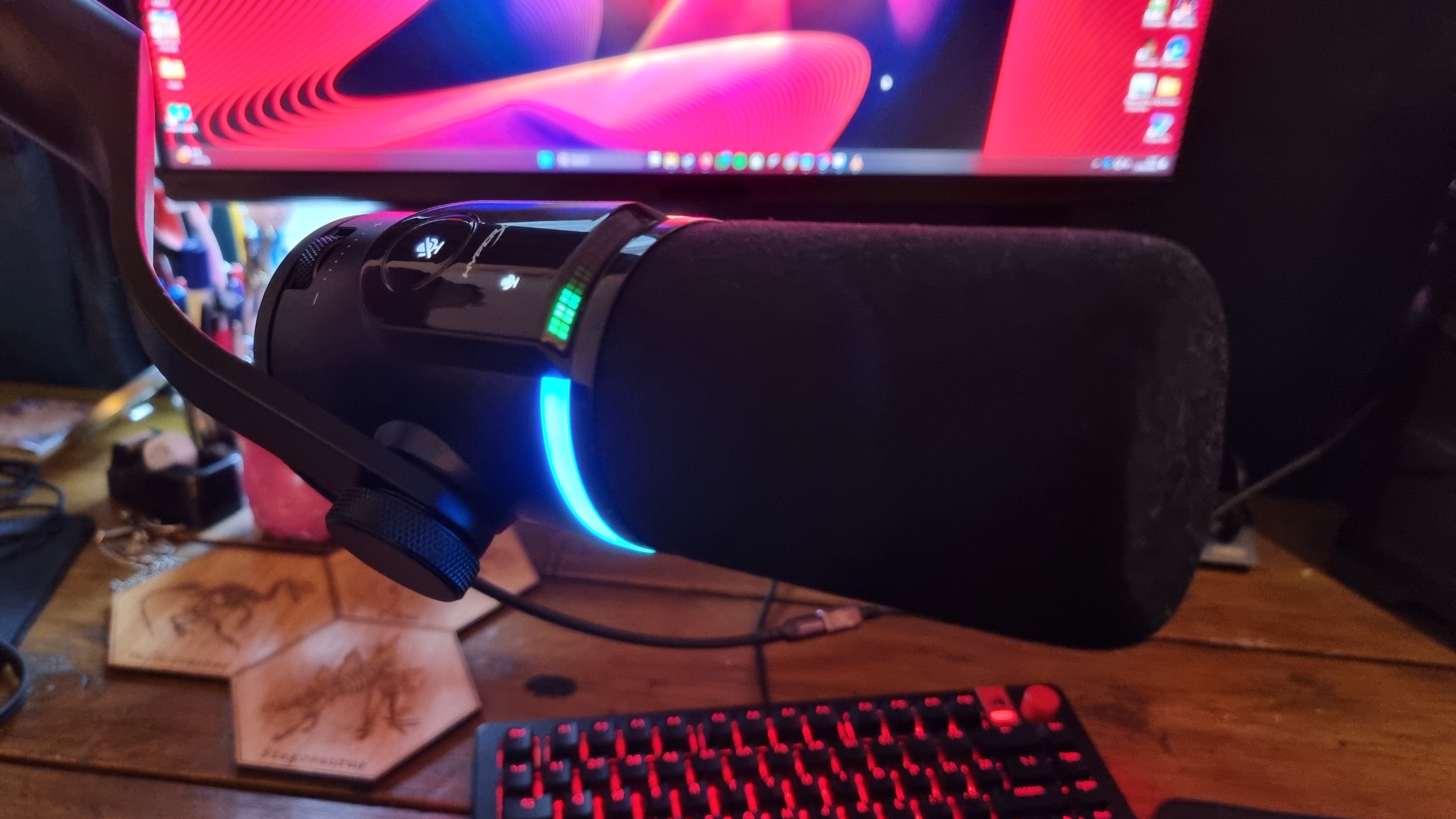 A HyperX FlipCast microphone shot from various angles to show the connection options and controls