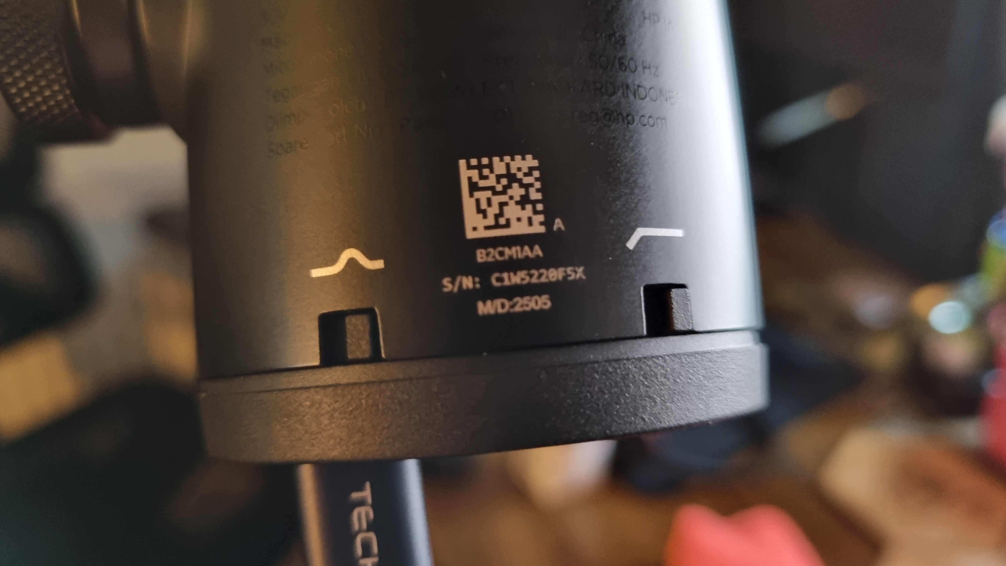 Two switches for a high pass filter and a presence boost on the rear of the HyperX FlipCast gaming microphone