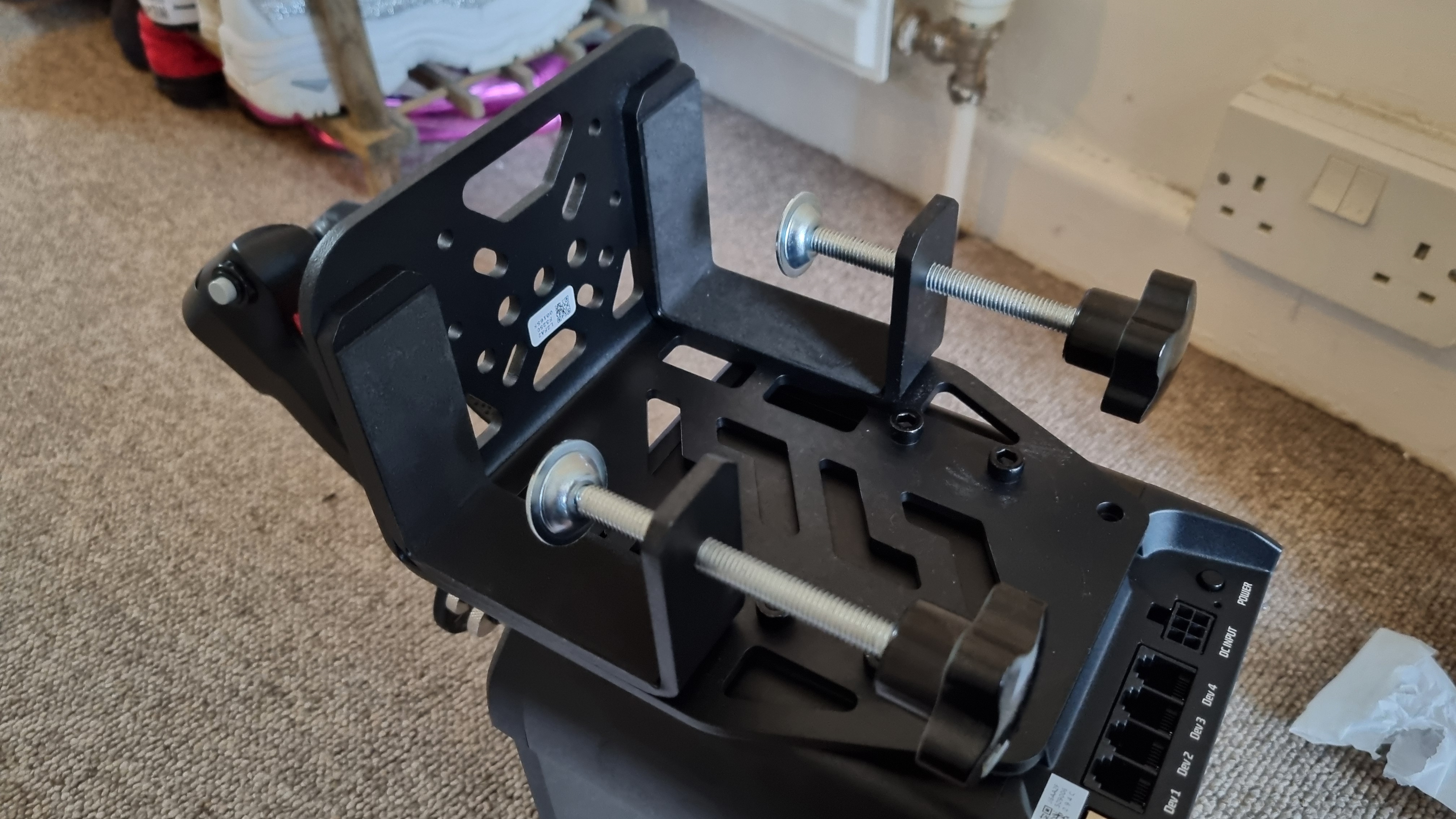 A desk clamp attached to a Moza AB9 FFB base