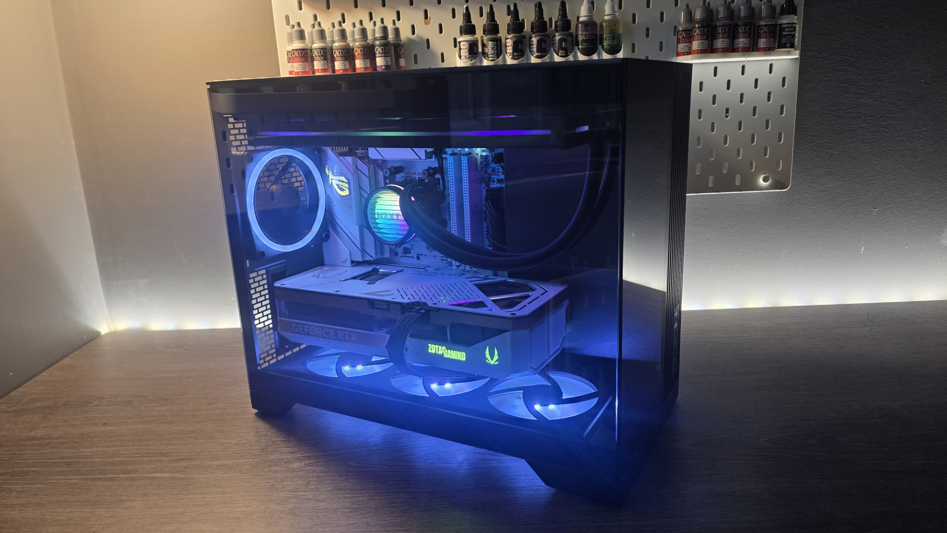 A Phanteks XT V3 PC case on a desk with various PC parts.