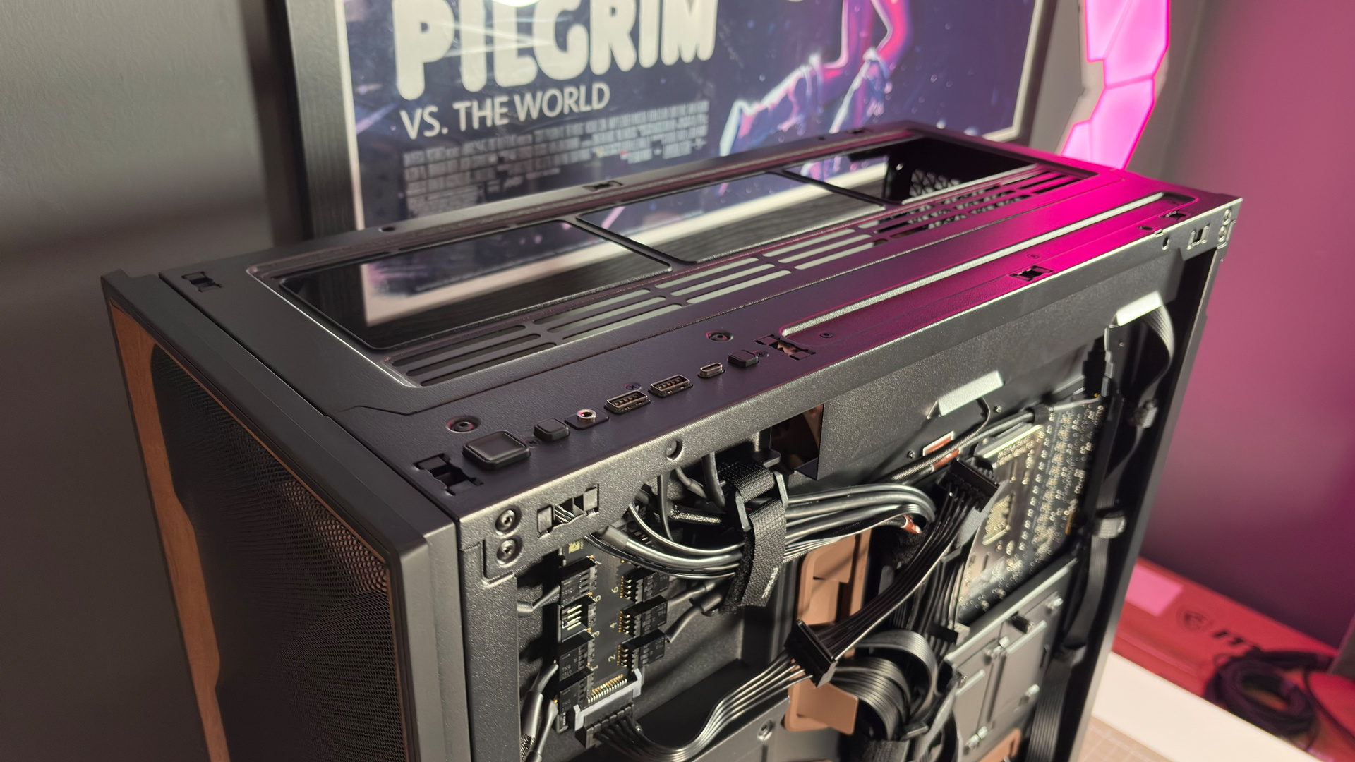 The Antec Flux Pro Noctua Edition on a desk with various parts disassembled.