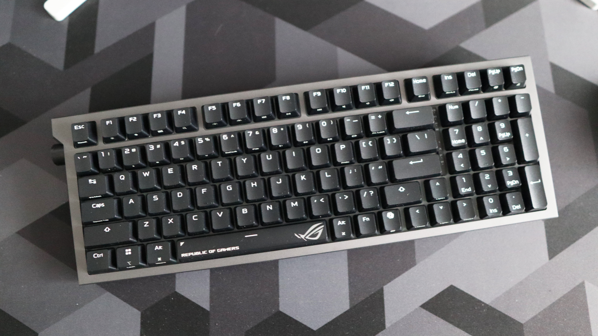 Asus ROG Strix Morph 96 Wireless on a desk mat.