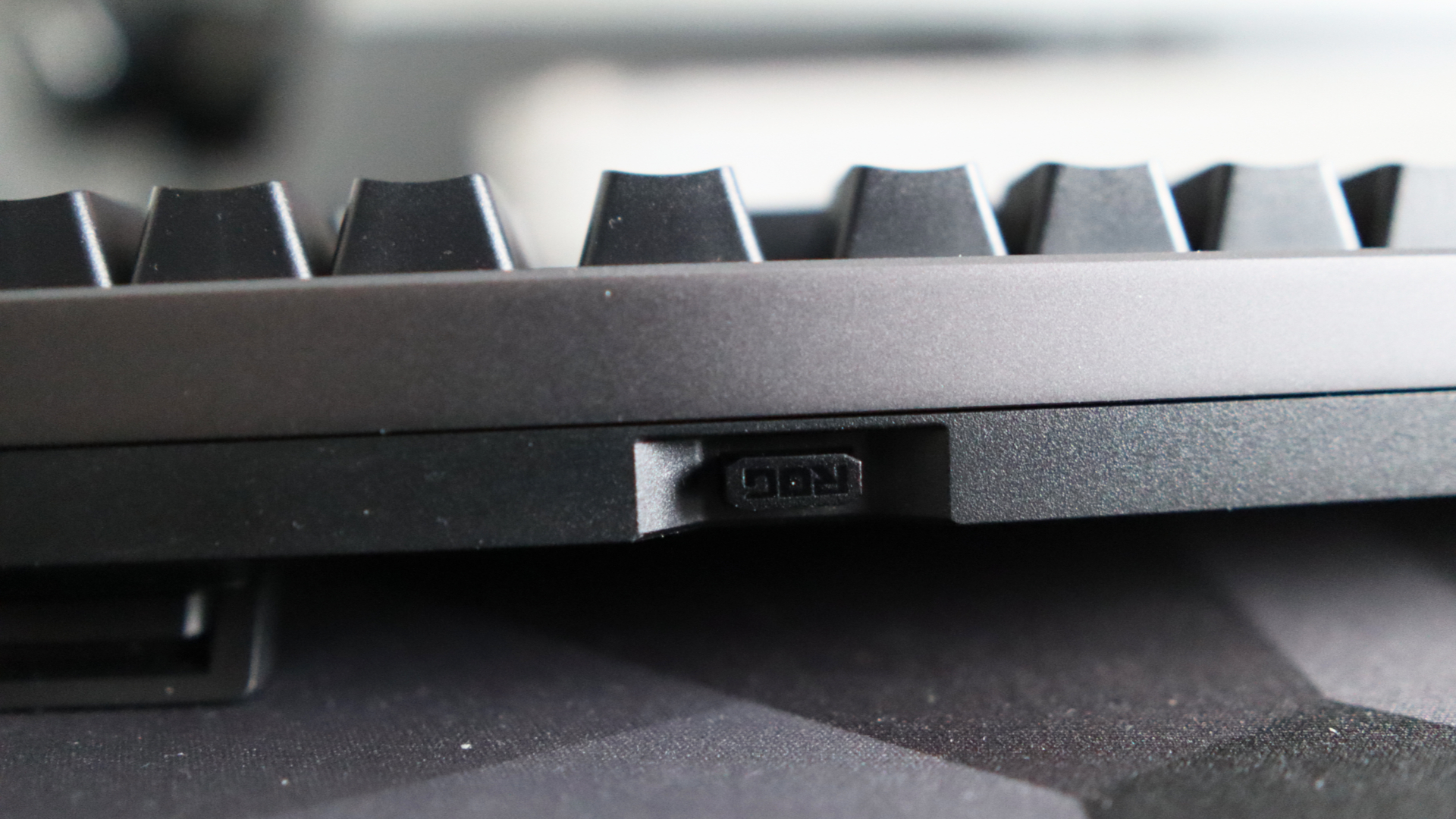 Asus ROG Strix Morph 96 Wireless on a desk mat.