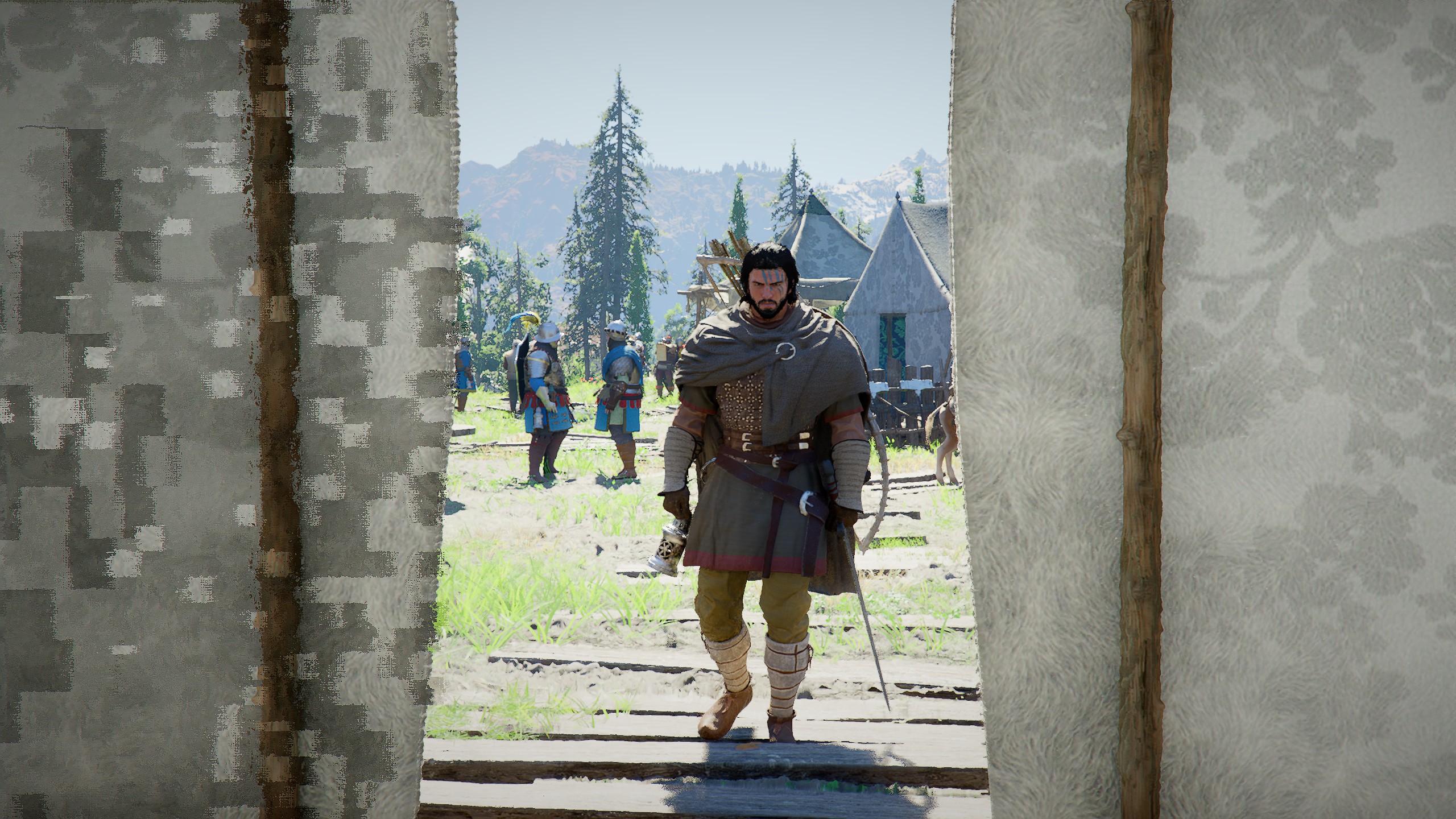 Kliff cooks a pan of vegetables over a bonfire, while a tent is in the background.