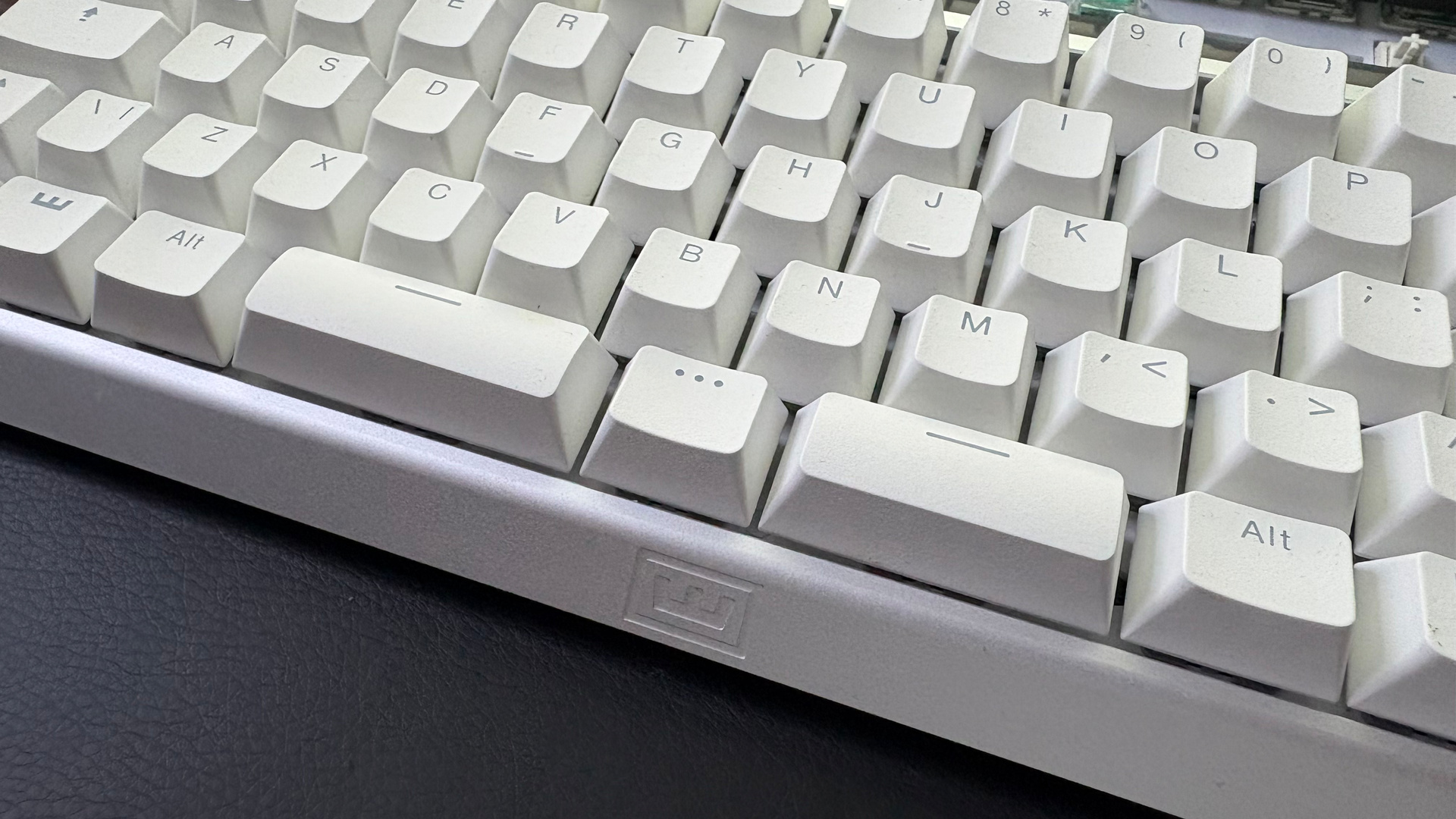 The Wooting 60HE v2 with a split spacebar on a desk alongside the Wooting 80HE with a normal spacebar.