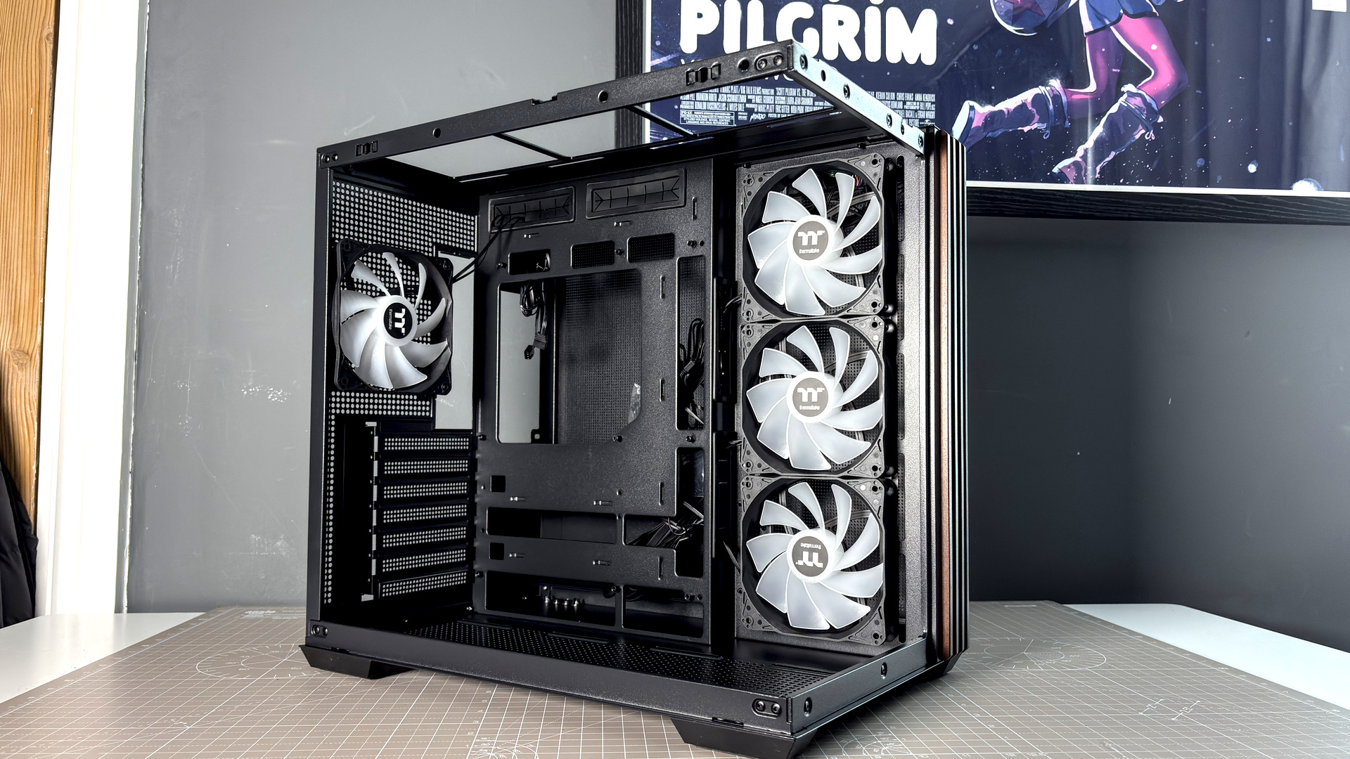 The Thermaltake View 380 WS ARGB on a desk with various components fitted.