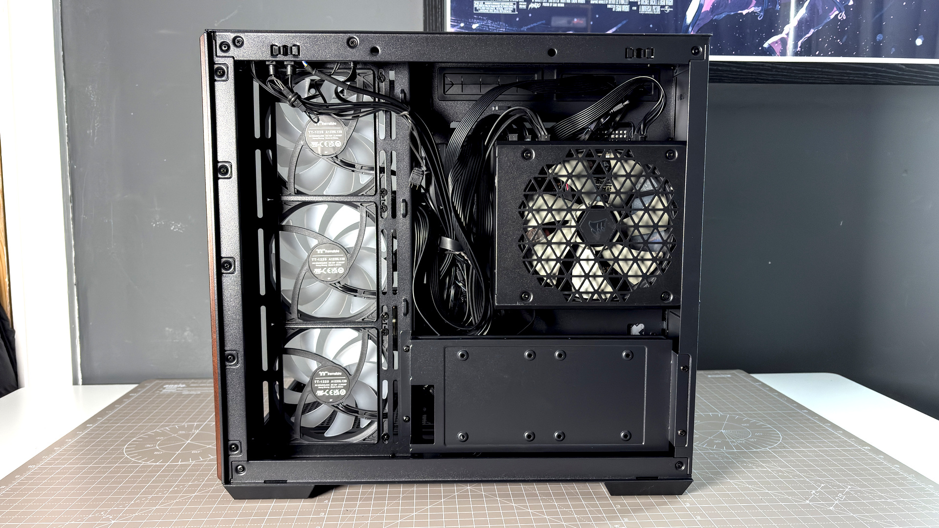 The Thermaltake View 380 WS ARGB on a desk with various components fitted.