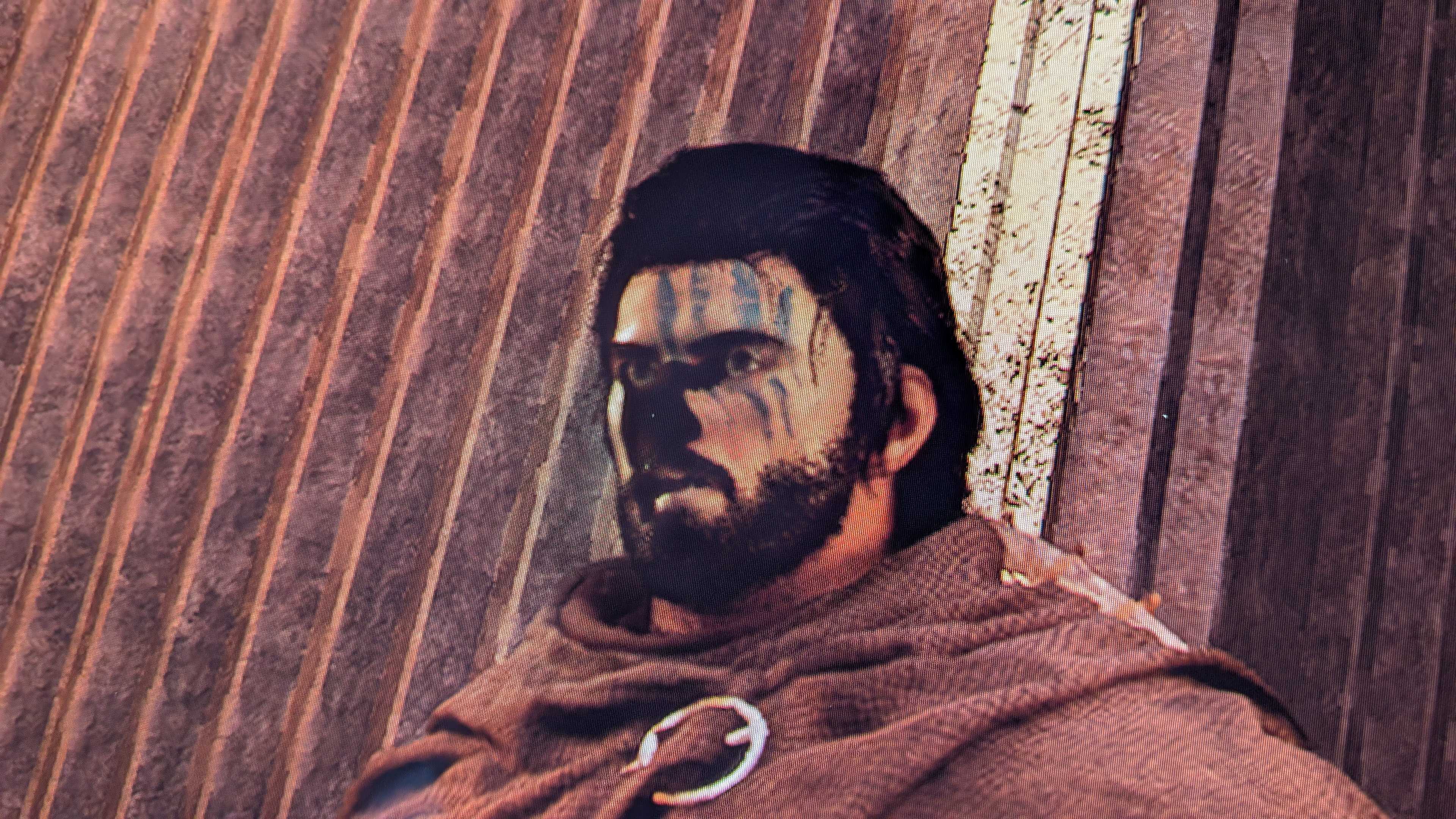 Crimson Desert's main character, Kliff, with a visual glitch on his face.