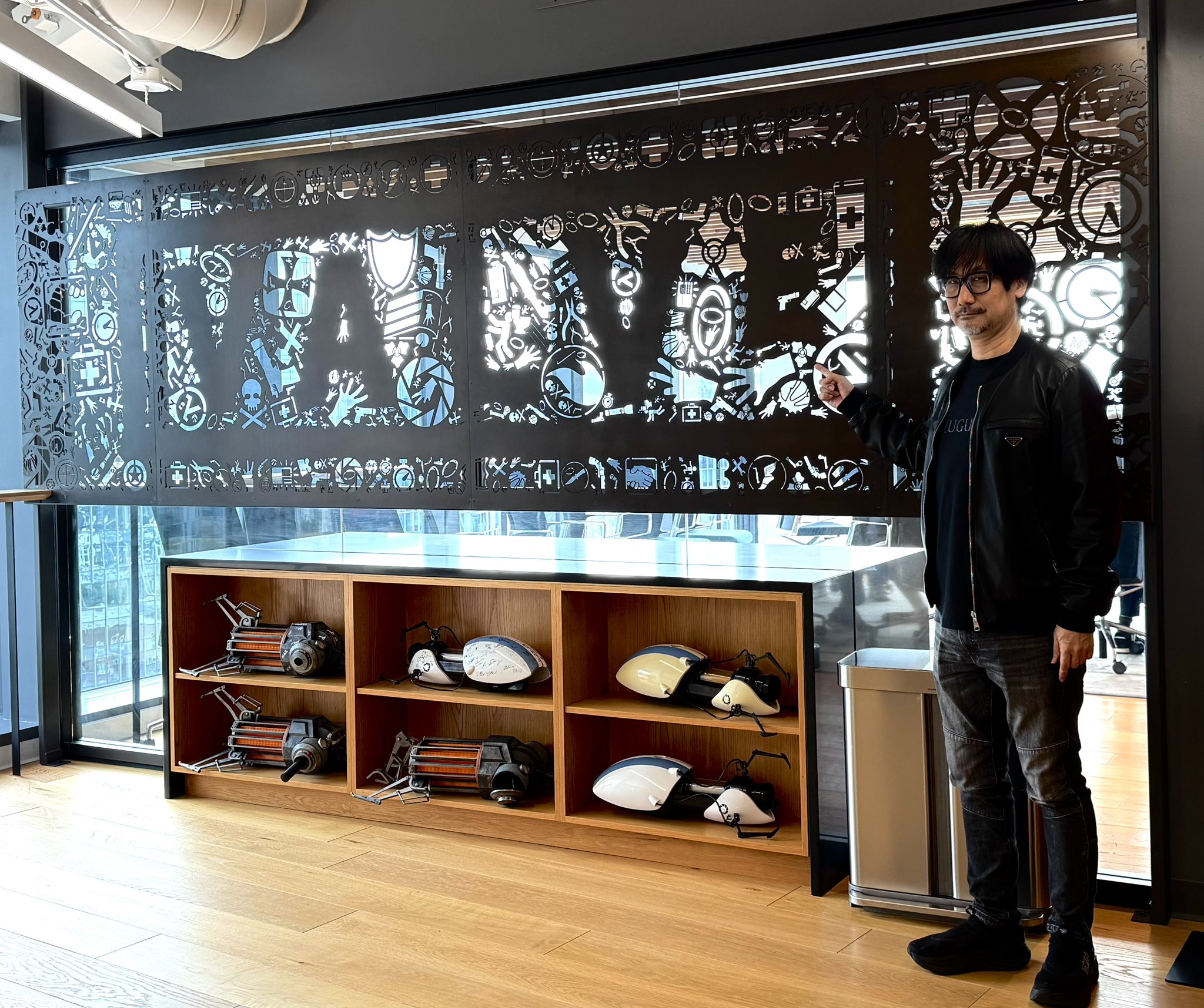 Hideo Kojima poses with various objects at Valve Software's offices.