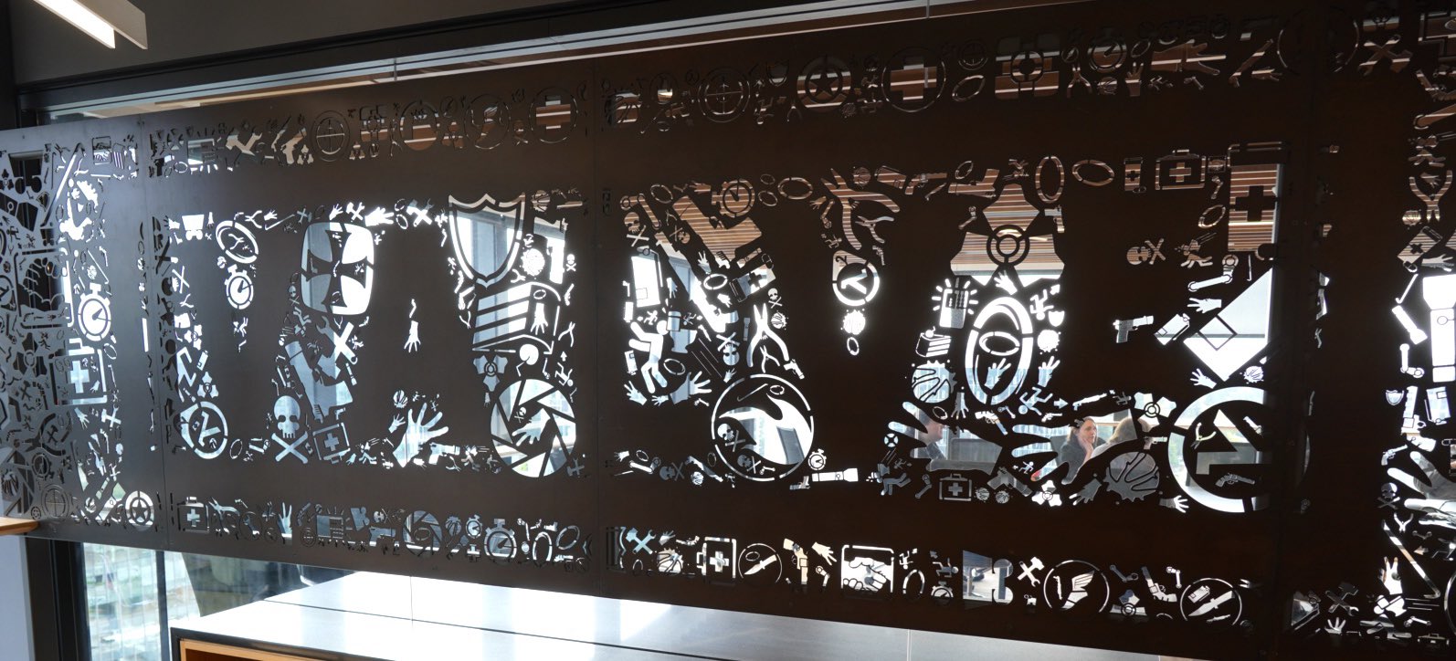 Hideo Kojima poses with various objects at Valve Software's offices.