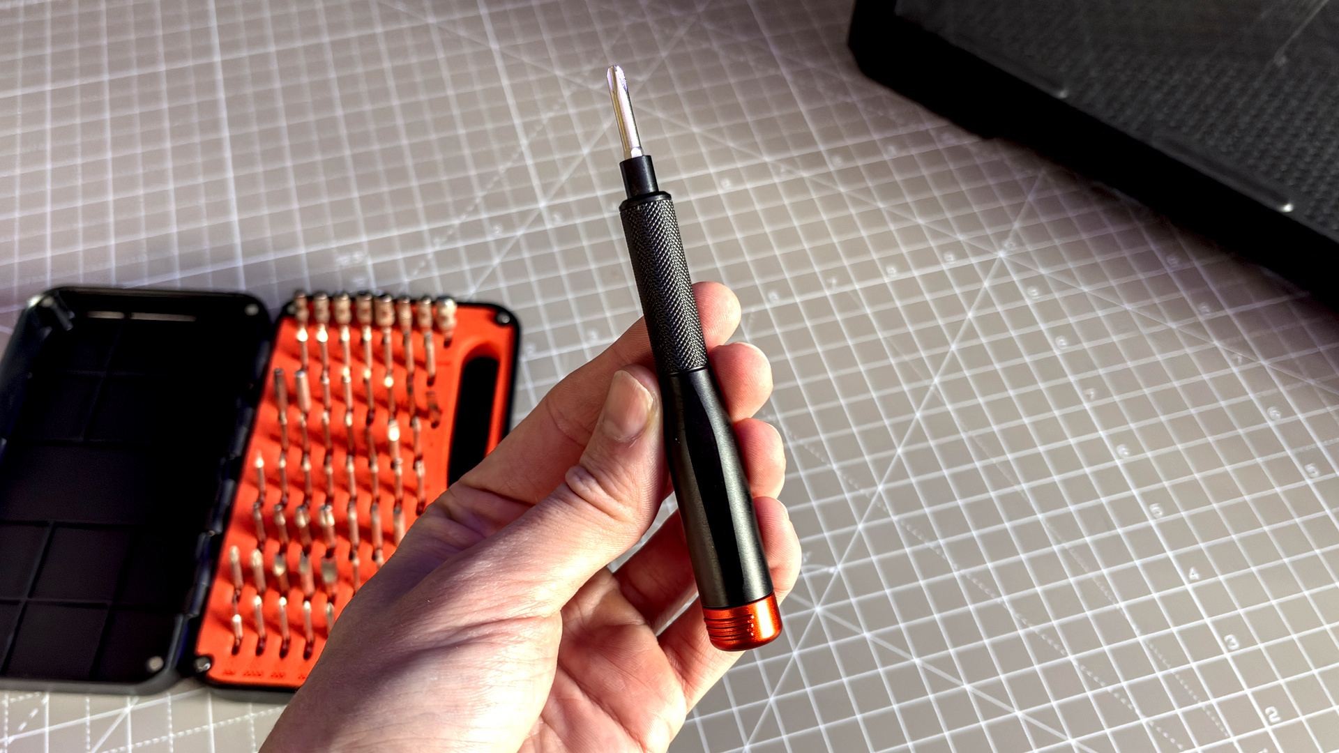 Two screwdrivers on a desk with orange highlights, sold by the YouTube channel Linus Tech Tips, or LTT for short.