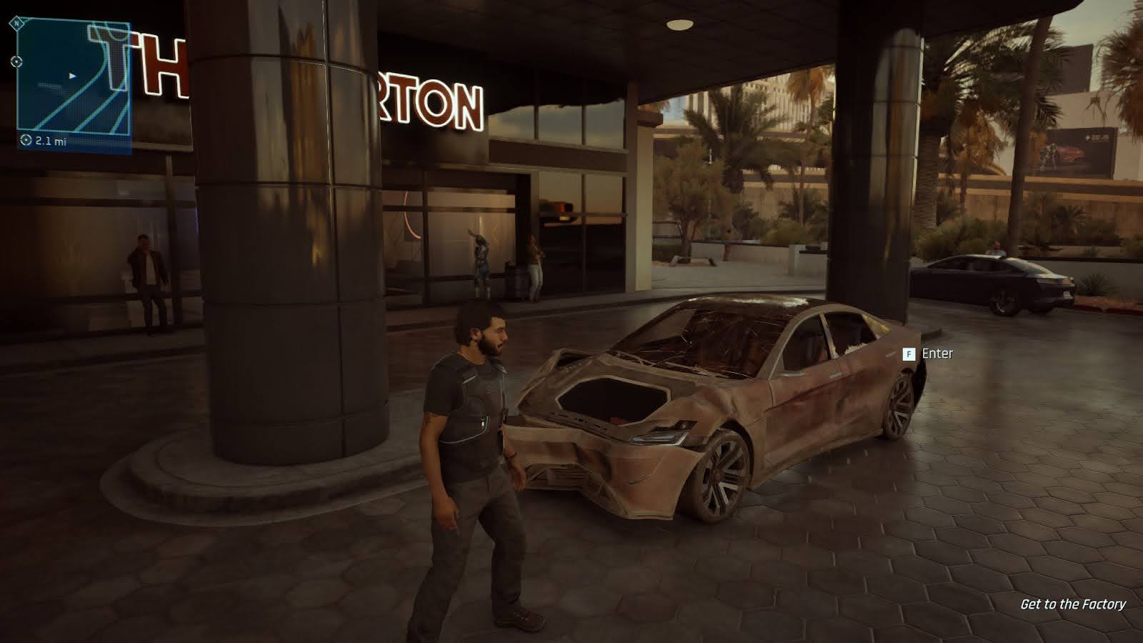 Jacob's dented car, its front end fully caved in, and glass cracked