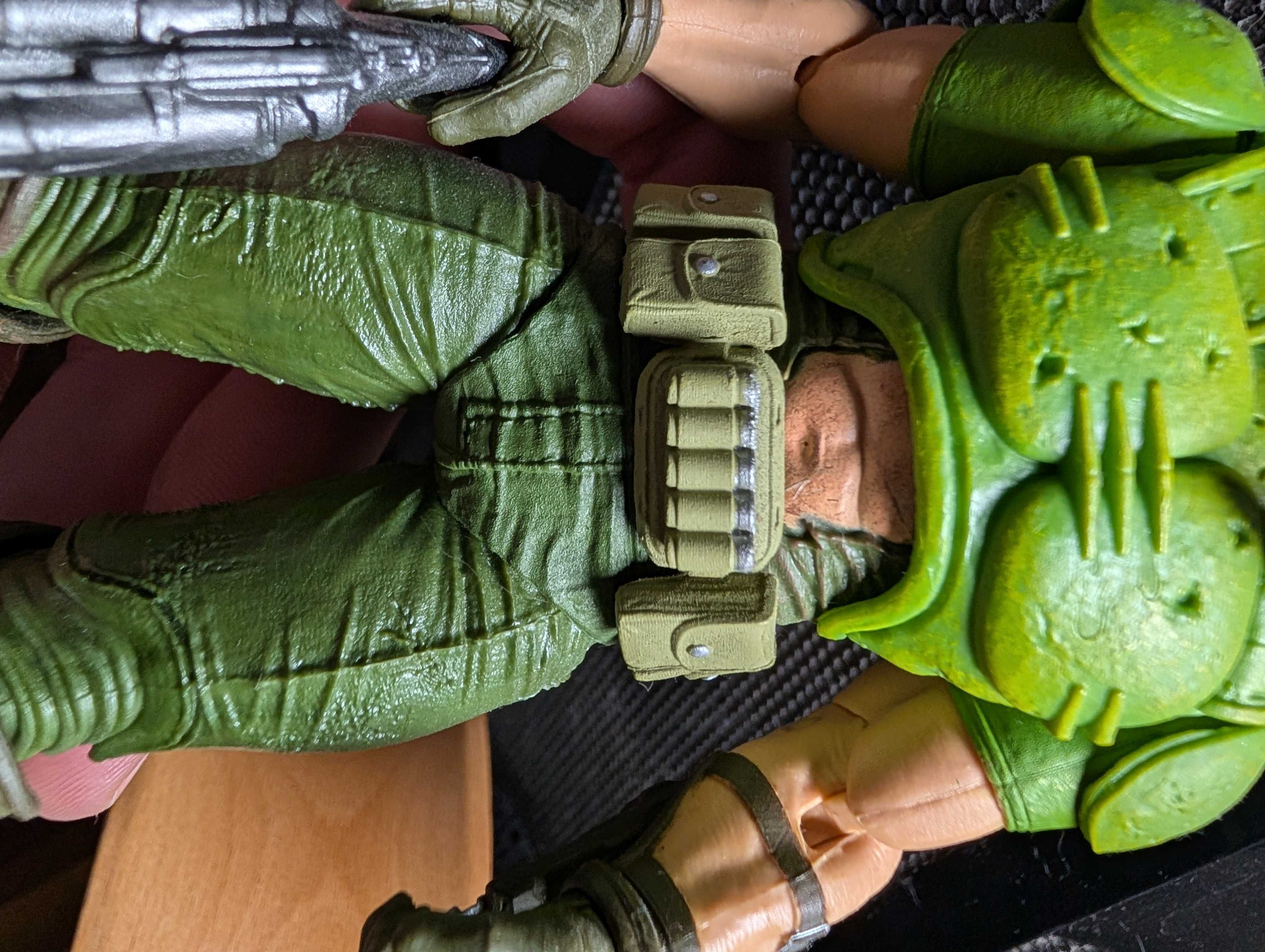 Close up of Doomguy action figure showing ripped shirt tummy window