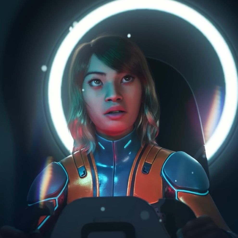 An explorer in the Subnautica 2 teaser trailer, her expression looks scared and in awe of something out in the dark ocean. We can't see what she's looking at.