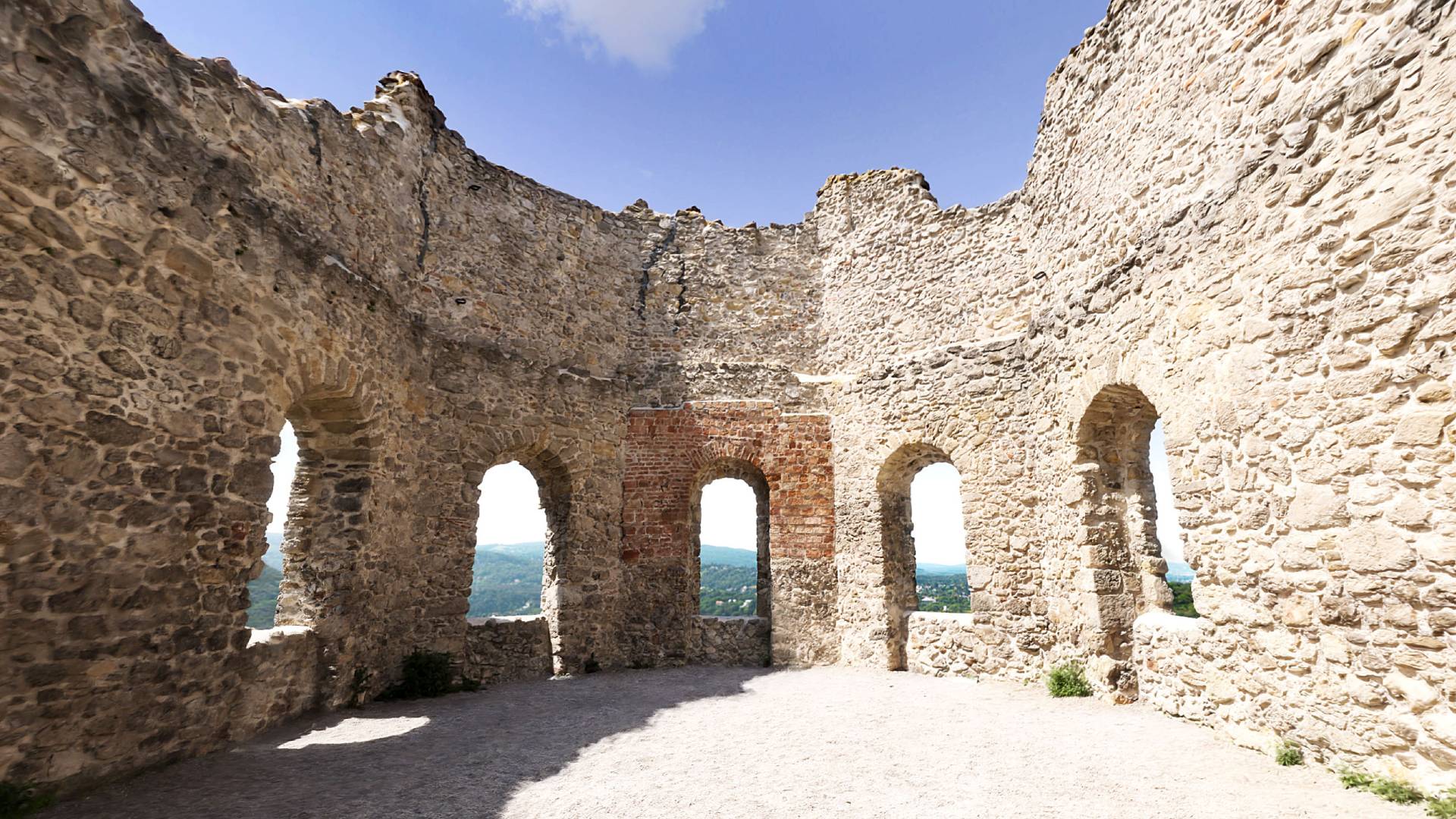 A Gaussian splat of some ruins created by scan artist Christoph Schindelar. Half of the structure is in direct sunlight, and half in shade.