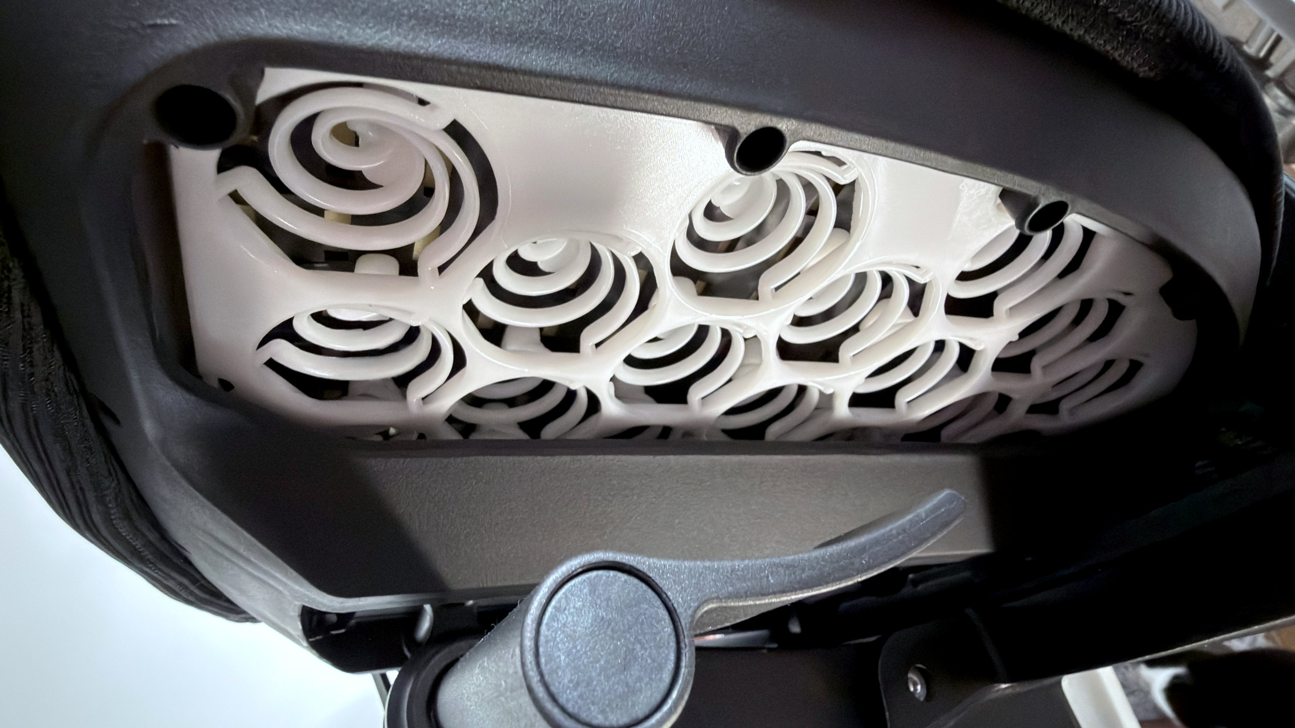 A photo of an Autonomous ErgoChair Ultra 2, showing a close-up view of the polymer springs used in the seat base
