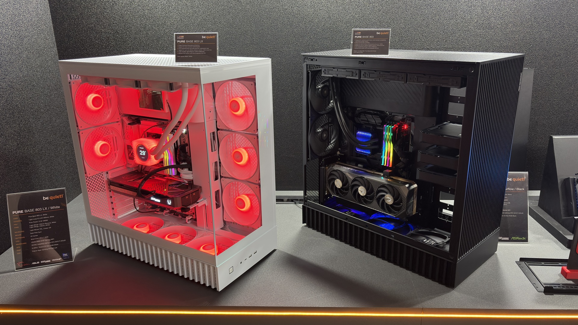 Be Quiet! Pure base 803 in black on a desk, beside the white version of the 803 LX